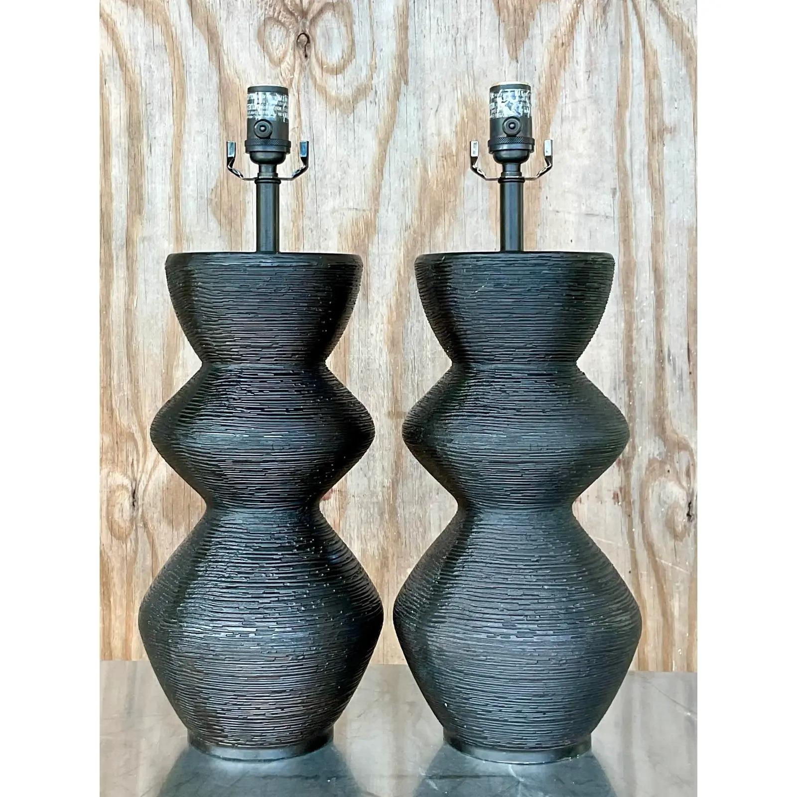A fantastic pair of vintage Contemporary Utopia table lamps. Made by the iconic Kelly Wearstler for Visual Comfort. A chic zig zag design in a deep black. A great textured surface. Acquired from a Palm Beach estate.
