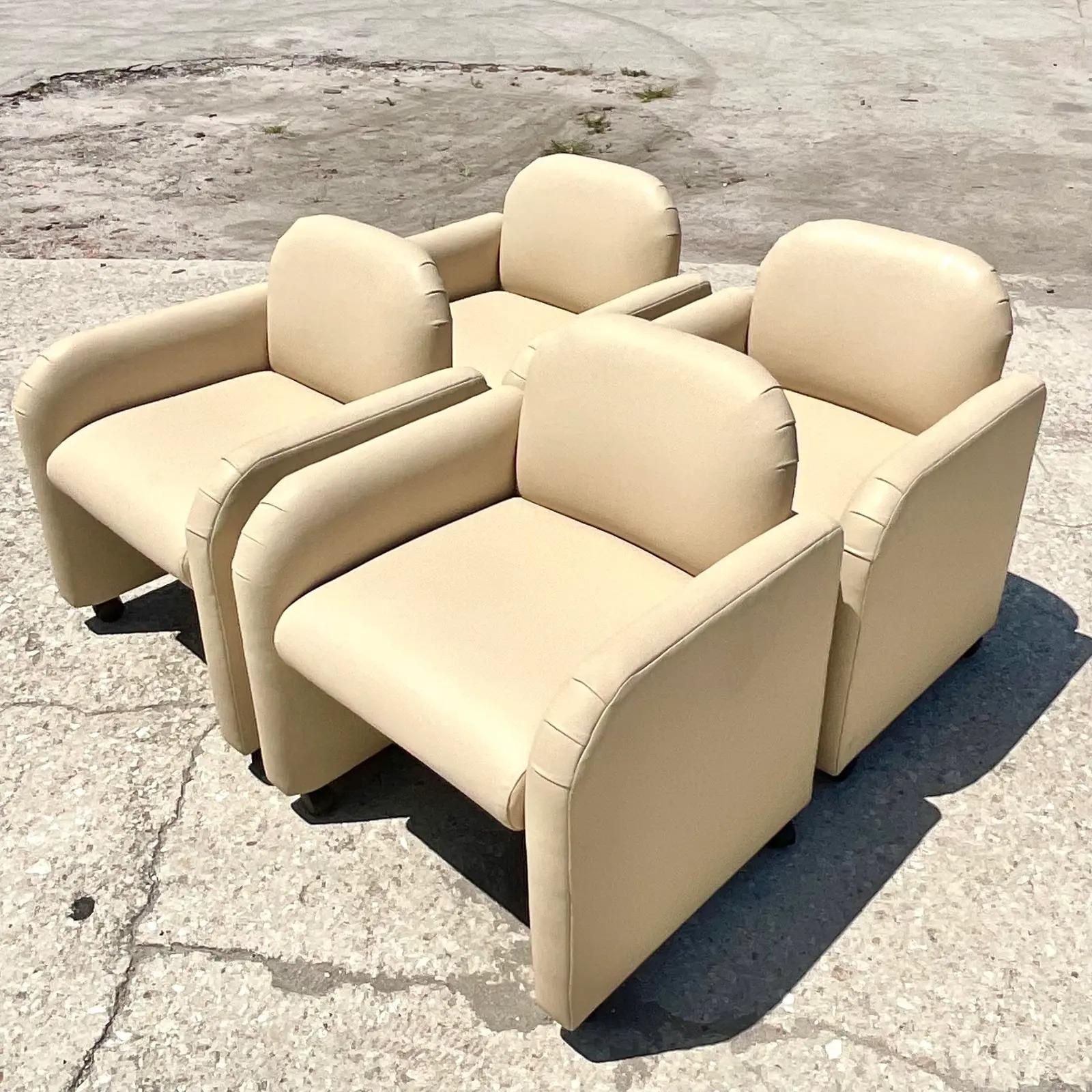 Fantastic set of four vintage PostModern lounge chairs. Beautiful leather upholstery in a classic shape. All chairs are on casters for easy movement. Easily for you to switch to regular feet if u prefer the chair to not move. Fabulous either way!