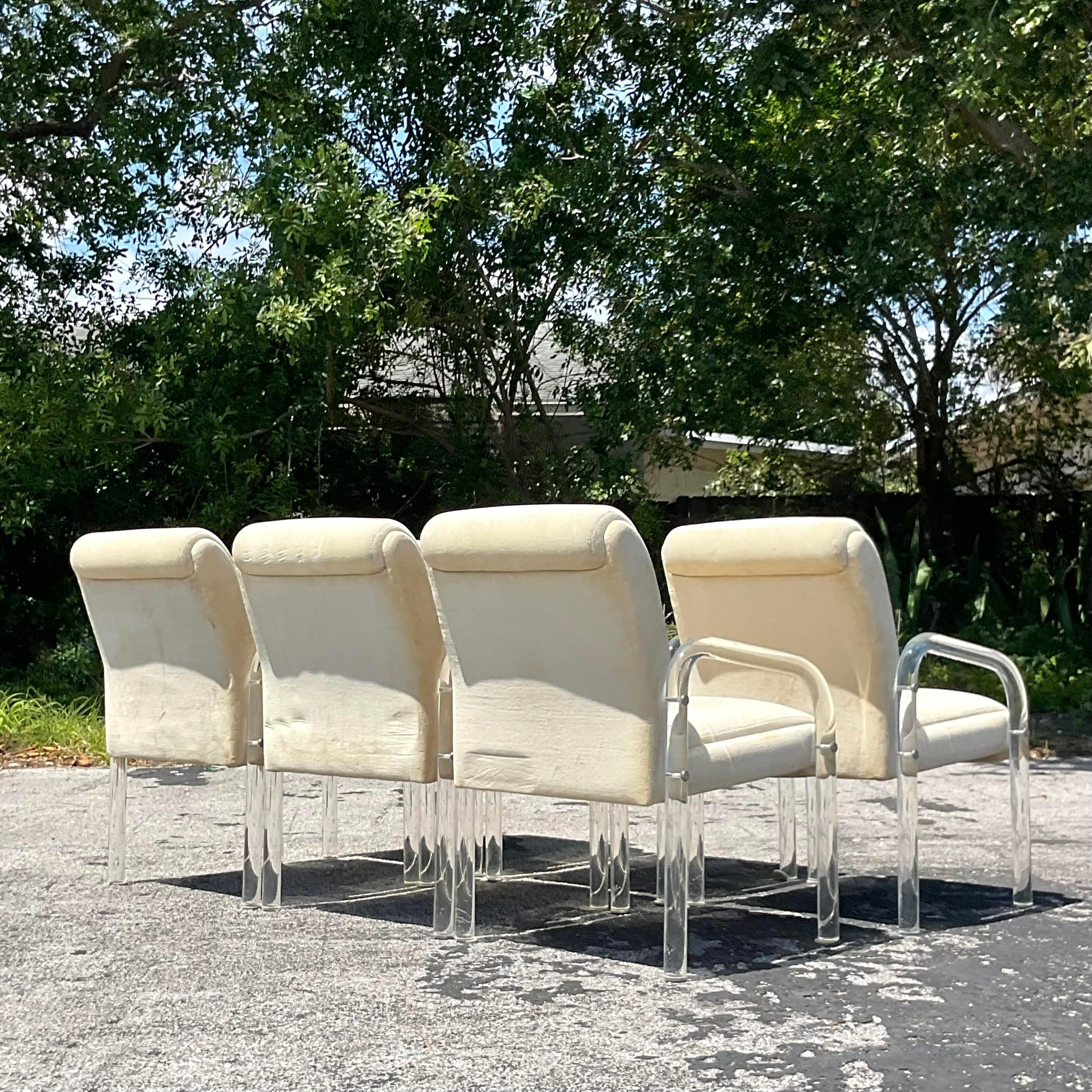 Upgrade your dining experience with our Vintage Contemporary Lucite Dining Chairs, inspired by Pace. Sold as a set of 6, these American-curated chairs showcase sleek lucite construction, blending modern design with timeless elegance for a