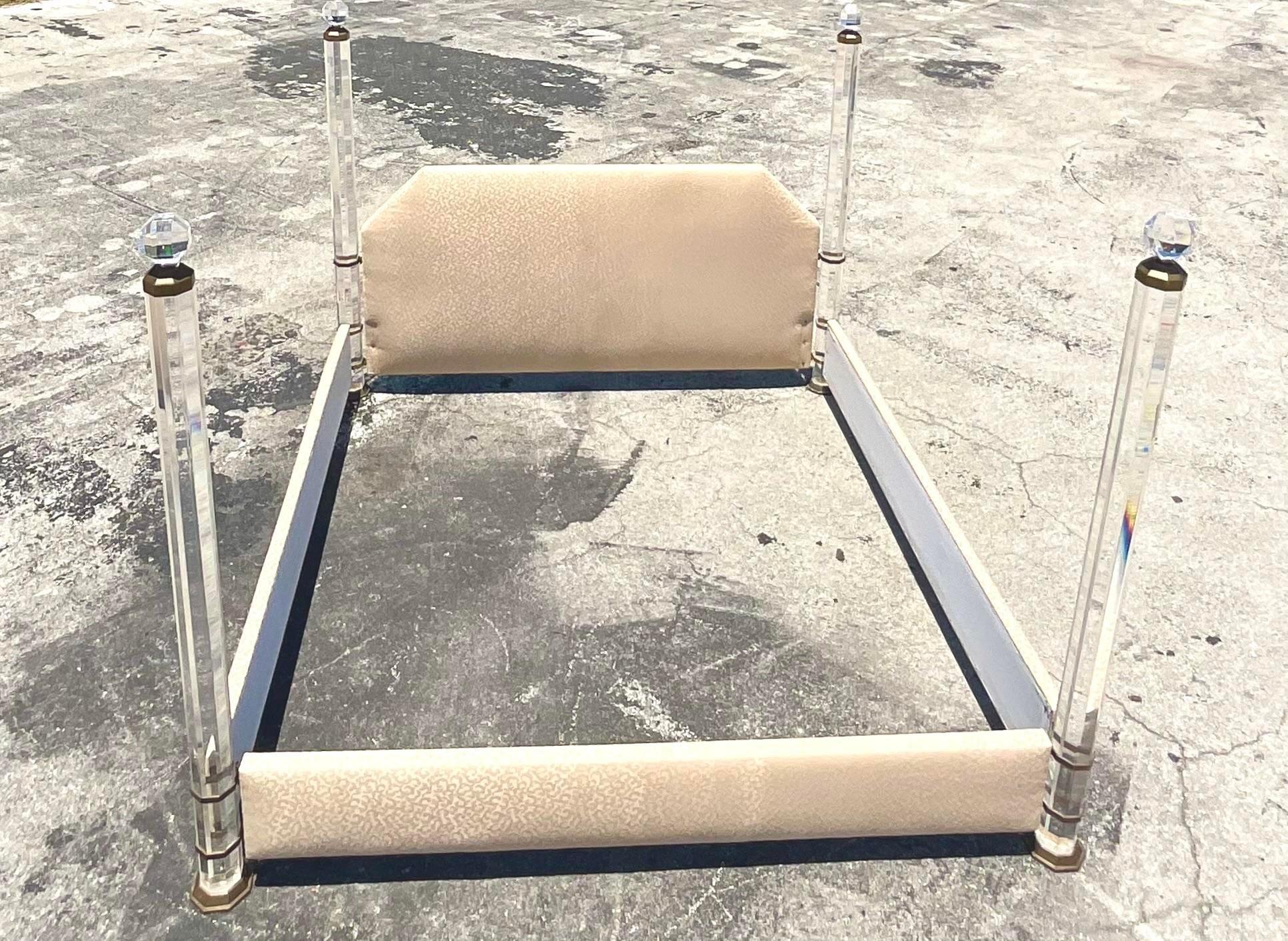 Fantastic vintage Contemporary King bed frame. Stunning lucite four poster bed with heavy brass details. Faceted posts for extra light movement. Beau trap cheetah print upholstery. Done in the manner of Charles Hollis Jones. Acquired from a Palm