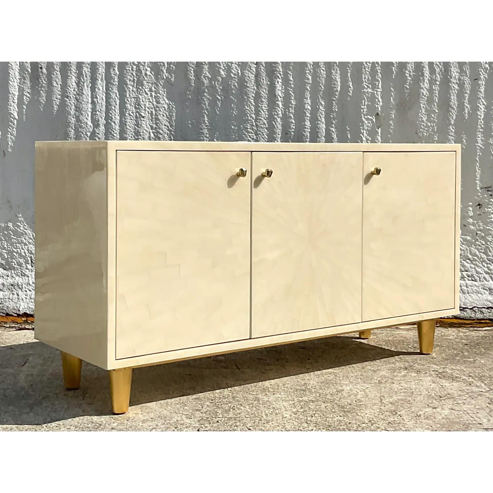 A fantastic vintage contemporary Faux horn credenza. Made by the iconic Made Goods group. A chic pale ivory gradient in a starburst design. Acquired from a Palm Beach estate.