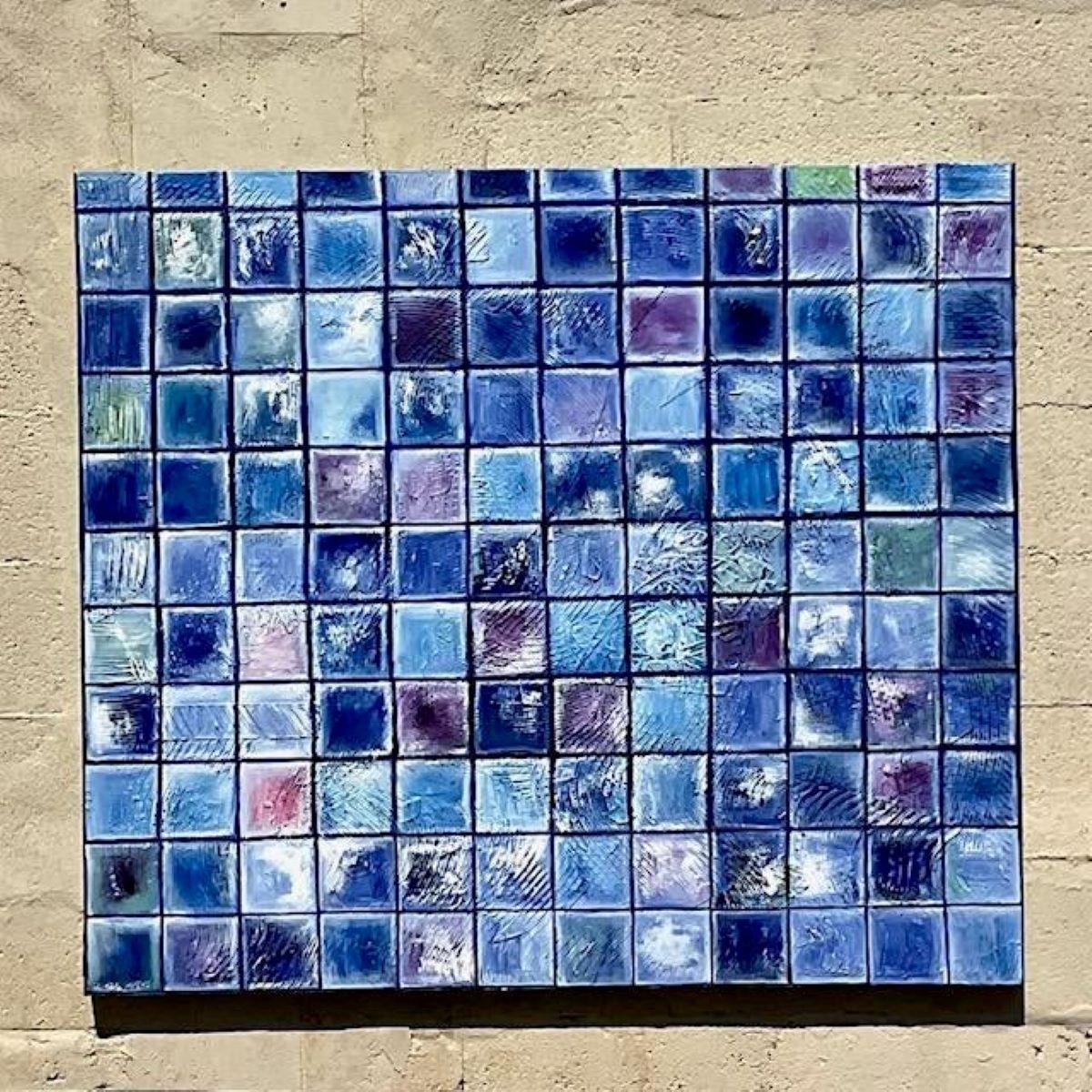 Add a touch of modern elegance to your space with this captivating vintage oil painting. Featuring a stunning array of blue blocks that blend seamlessly into one another, this piece embodies a contemporary yet timeless aesthetic. The rich shades of