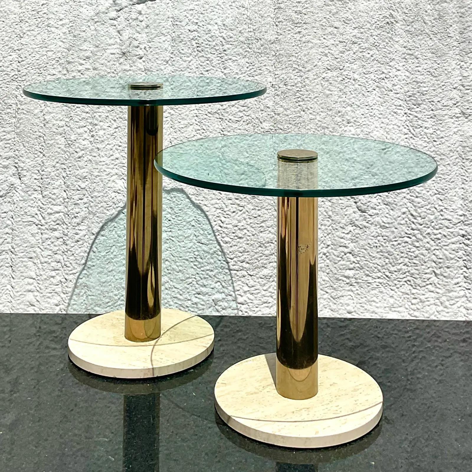 A chic pair of vintage Contemporary drinks table. Made by the iconic Pace Collection. Beautiful marble bases with brass pedestals and glass tops. Acquired from a Palm Beach estate.