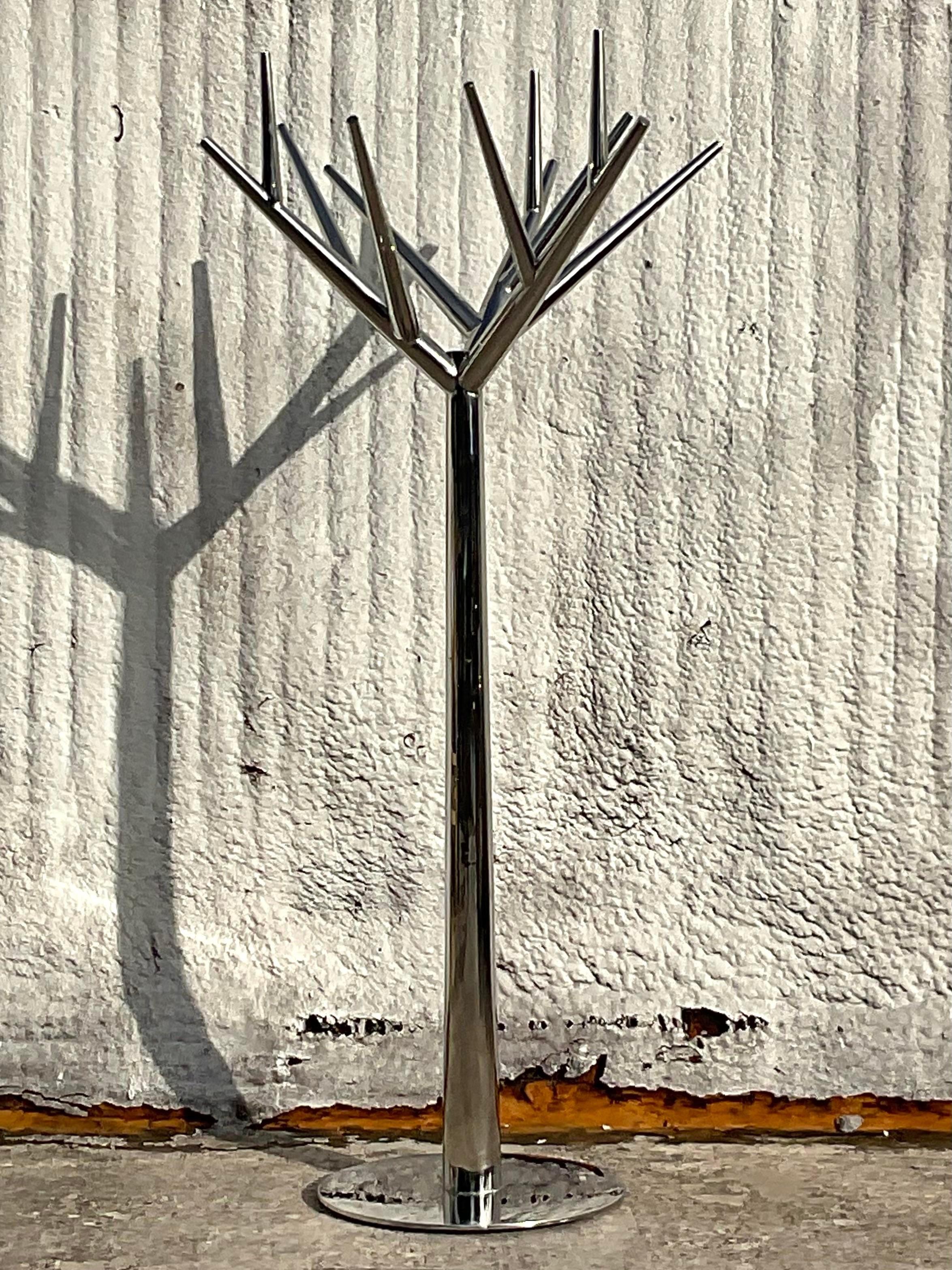 A fantastic vintage Contemporary coat rack. A chic polished chrome body in a clean modern tree motif. Perfect as a coat rack, but is also a gorgeous sculpture. You decide! Acquired from a Palm Beach estate. 
