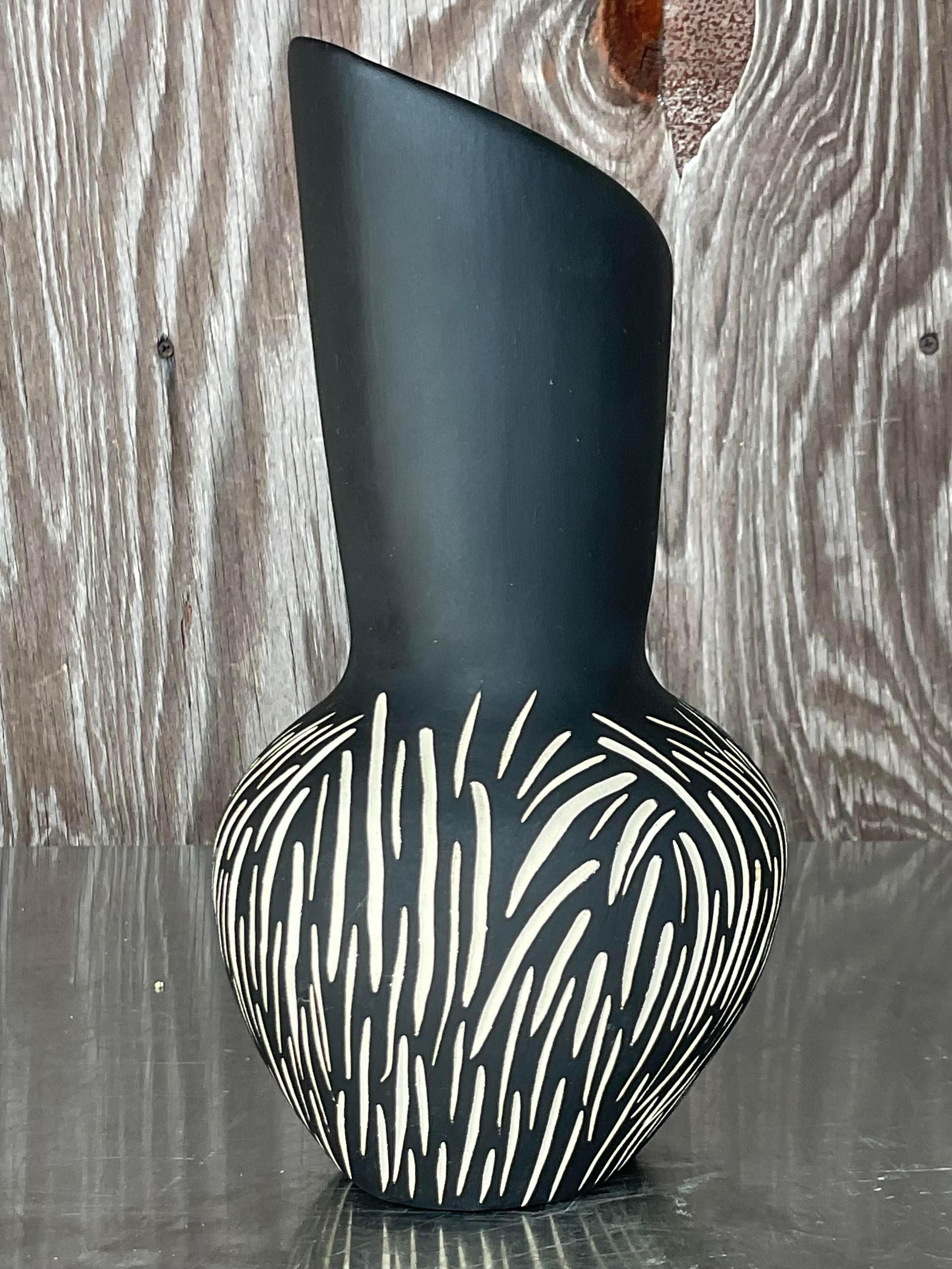 A spectacular vintage Contemporary studio pottery vase. A chic graphic design with beautiful organic movement. Stamped by the artist. Acquired from a Palm Beach estate. 