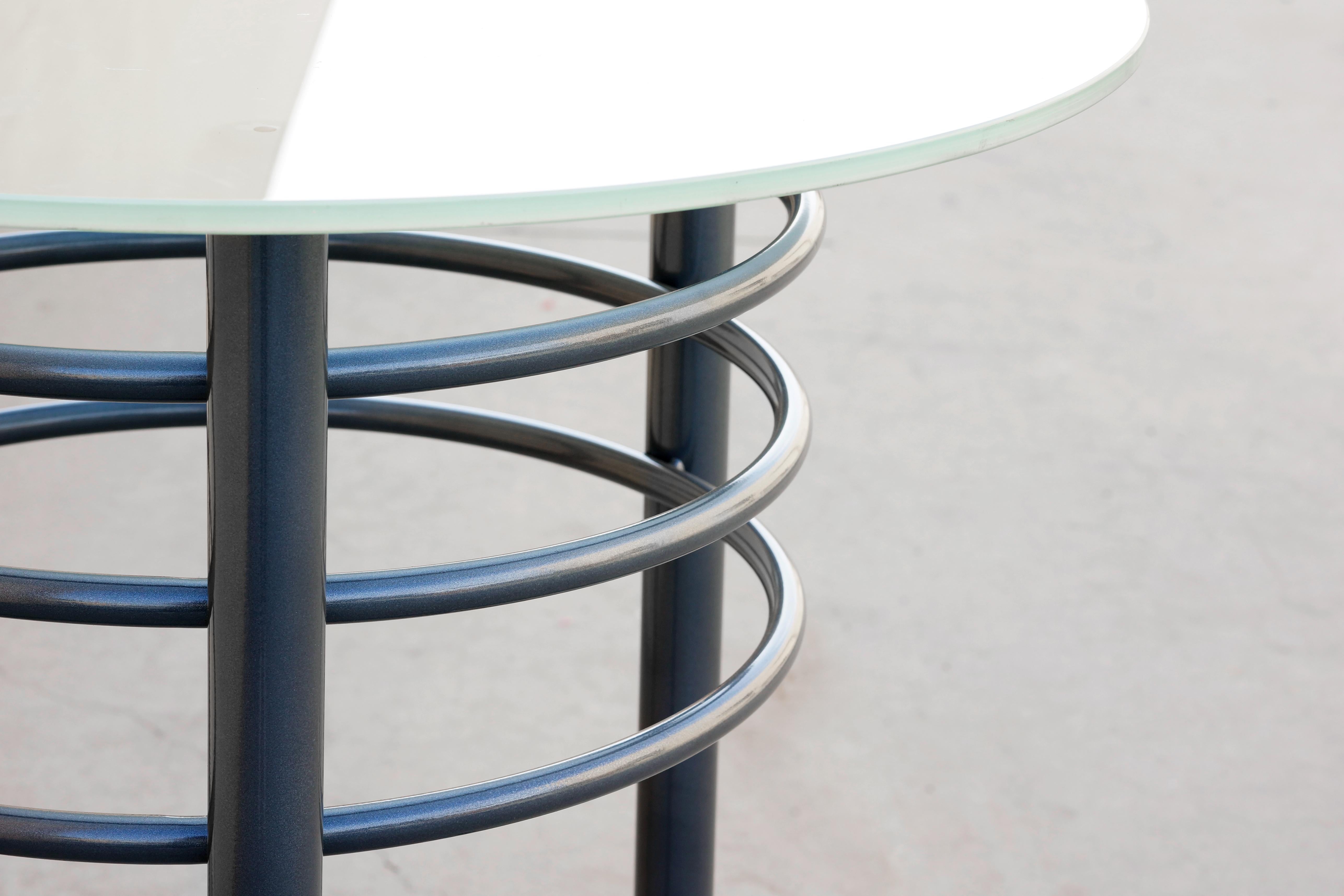 Contemporary steel cocktail table designed with a bit of 