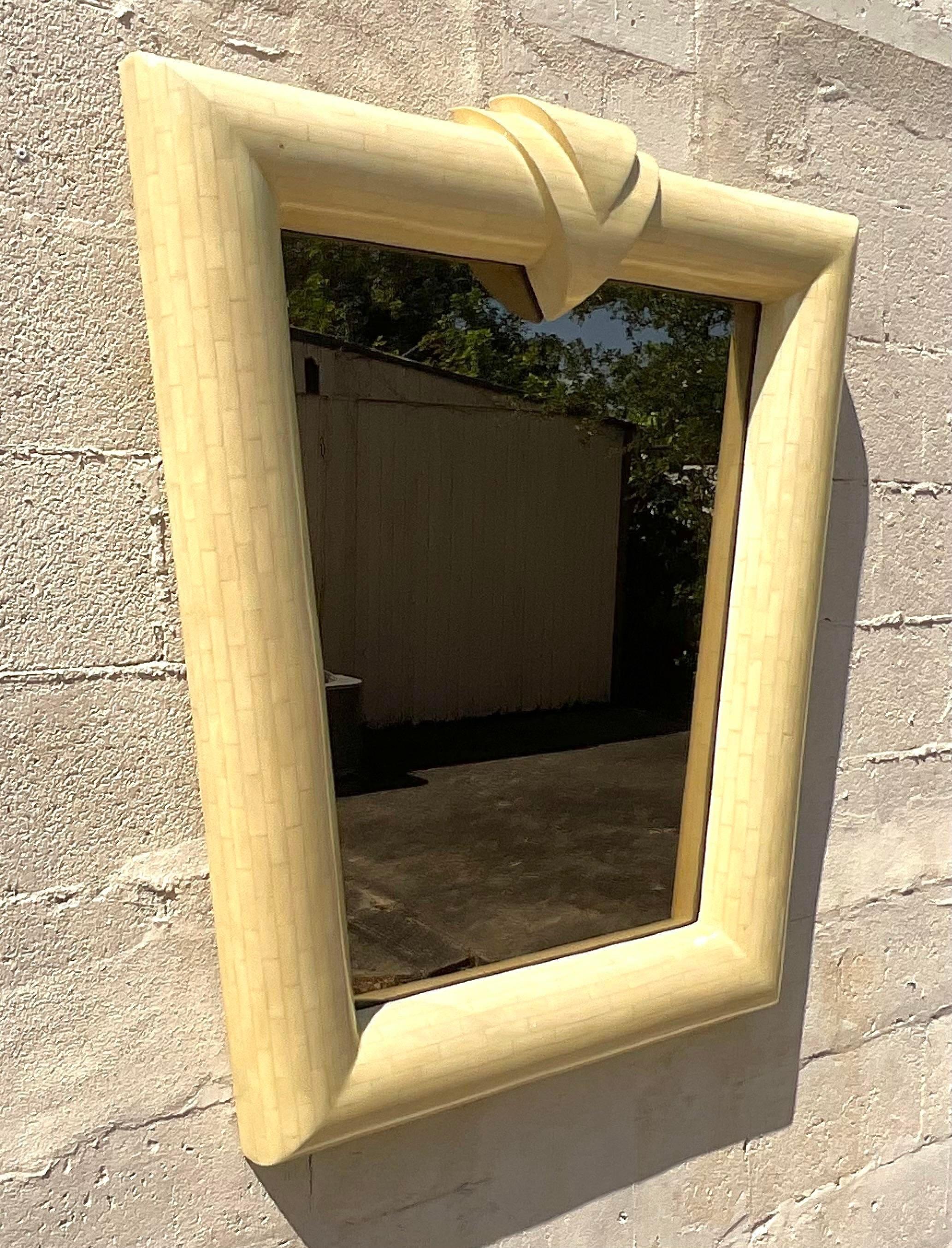An exceptional vintage Contemporary wall mirror. Chic tessellated bone in a stunning Postmodern design. Acquired from a Palm Beach estate.