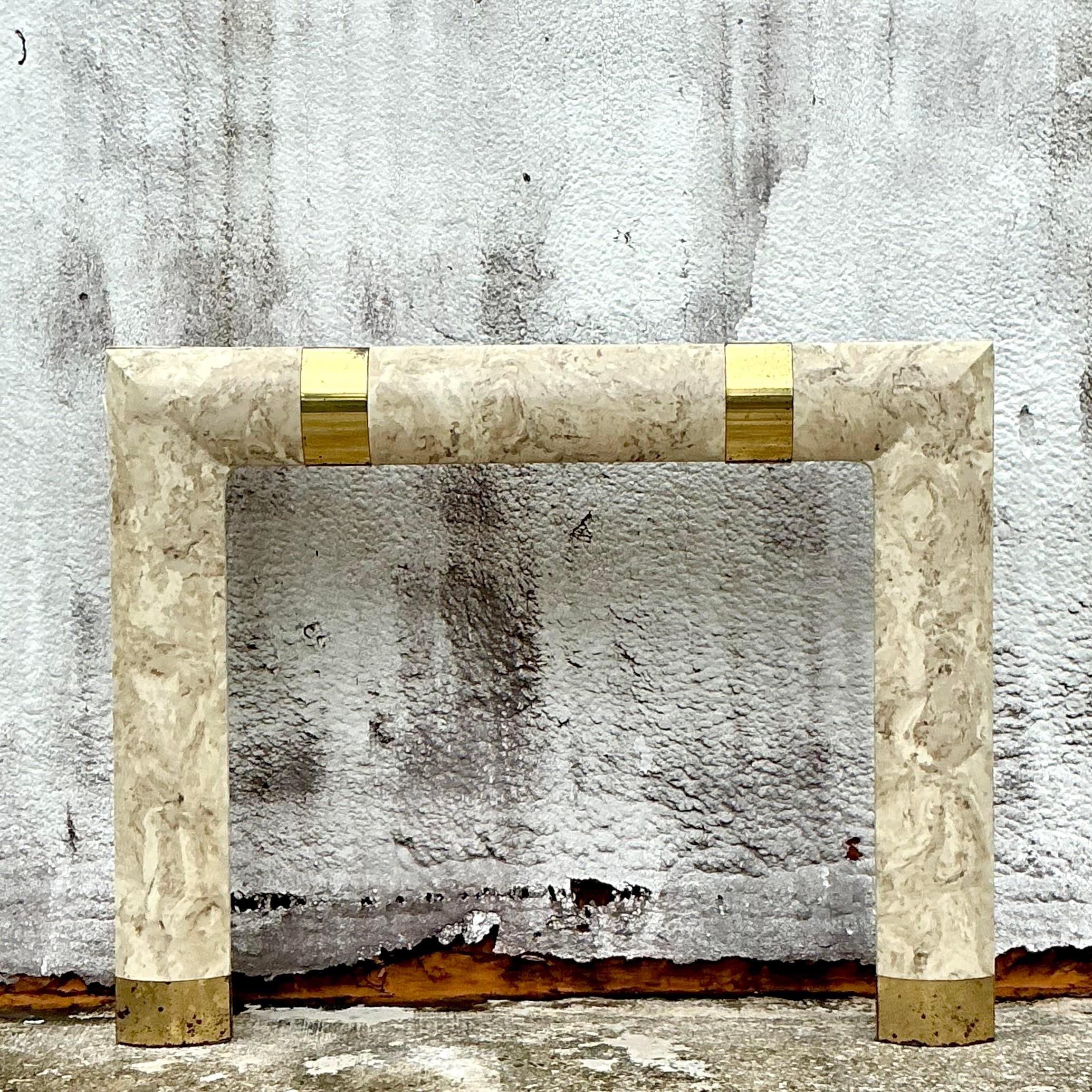 Elevate your fireplace with the sleek elegance of this Vintage Contemporary Travertine and Brass Fireplace Surround. This striking piece blends the timeless appeal of travertine stone with the sophisticated sheen of brass accents, creating a modern