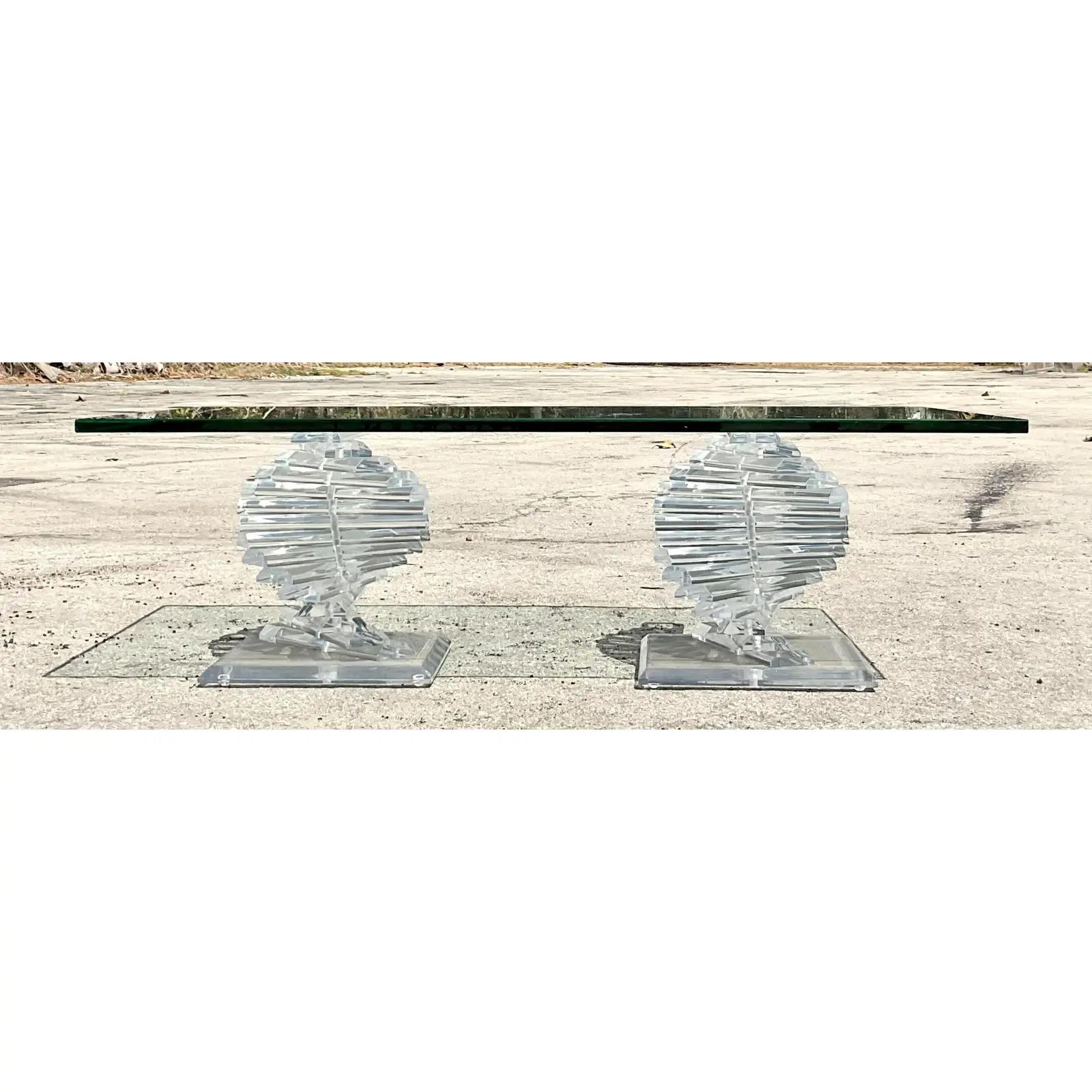 Spectacular vintage twisted lucite coffee table. Two independent spirals of gorgeous clear lucite. Acquired from a Palm Beach estate.