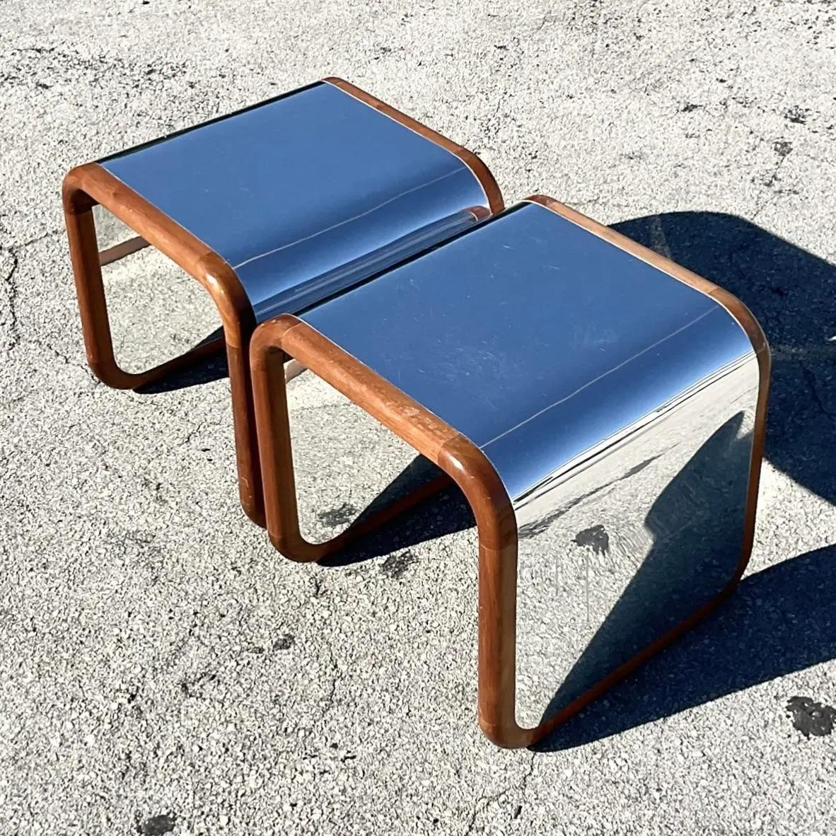 A fabulous pair of vintage Contemporary side tables. Chic waterfall shape in chrome and wood. Acquired from a Palm Beach estate.
