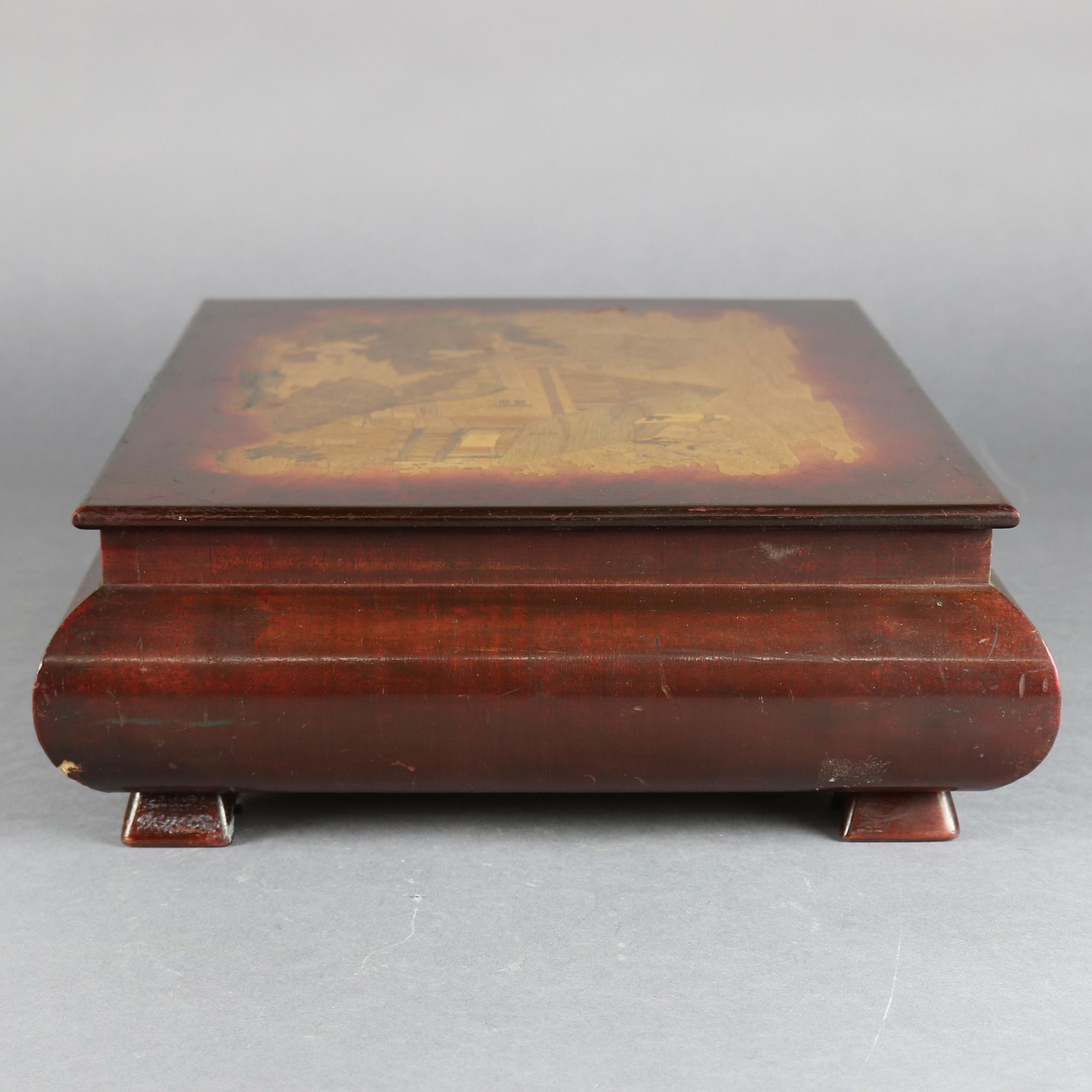 A vintage Continental pictorial document box features mahogany construction with top having inlaid country scene with creekside house and water wheel, convex sides and seated on pyramidal feet, circa 1940.

***DELIVERY NOTICE – Due to COVID-19 we