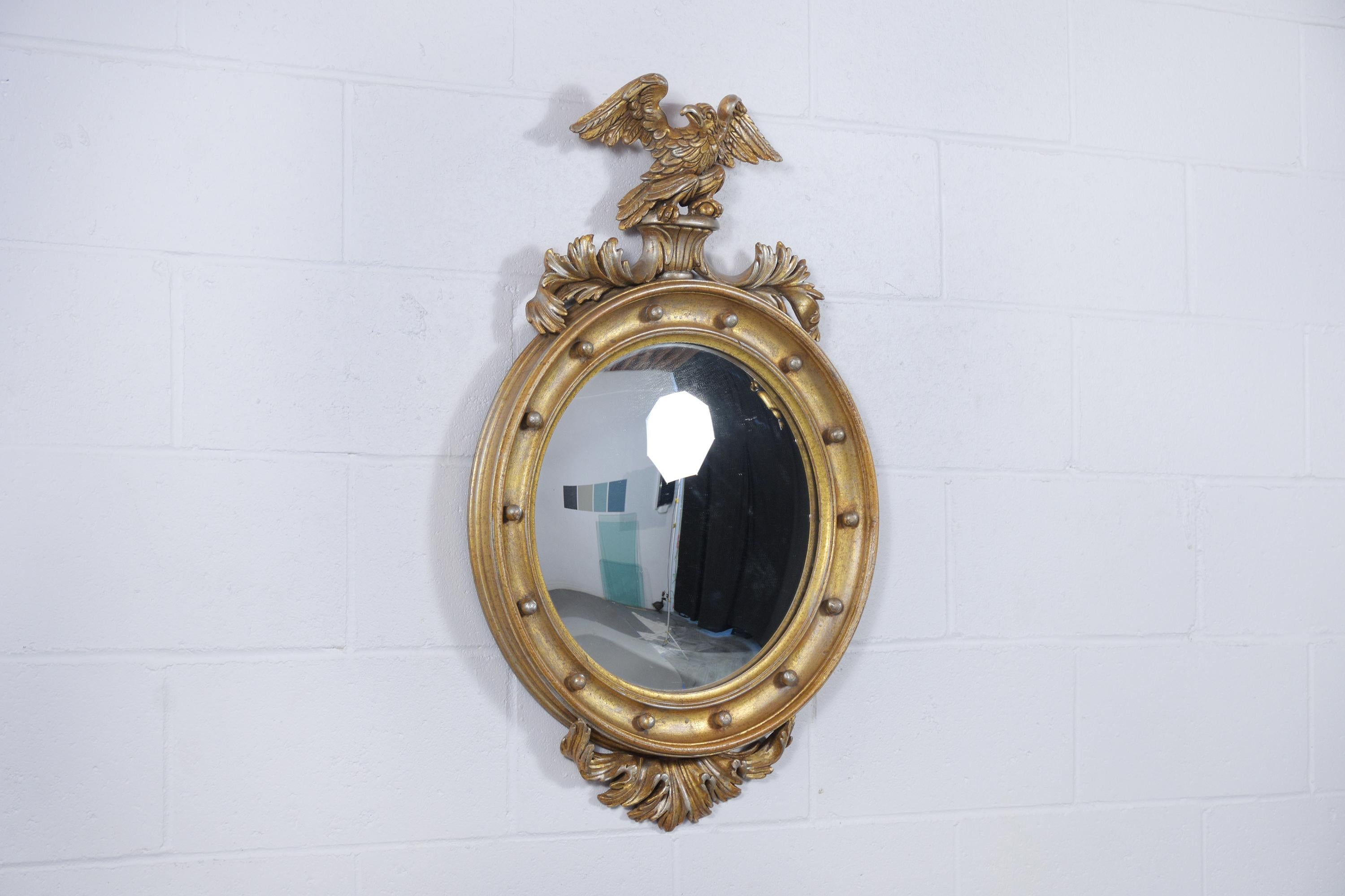 Immerse yourself in the sophistication of our vintage Italian American Federal-style oval wall mirror. This exquisite piece is hand-crafted from premium maple wood, demonstrating the finesse and skill of traditional craftsmanship. Measuring 15.25