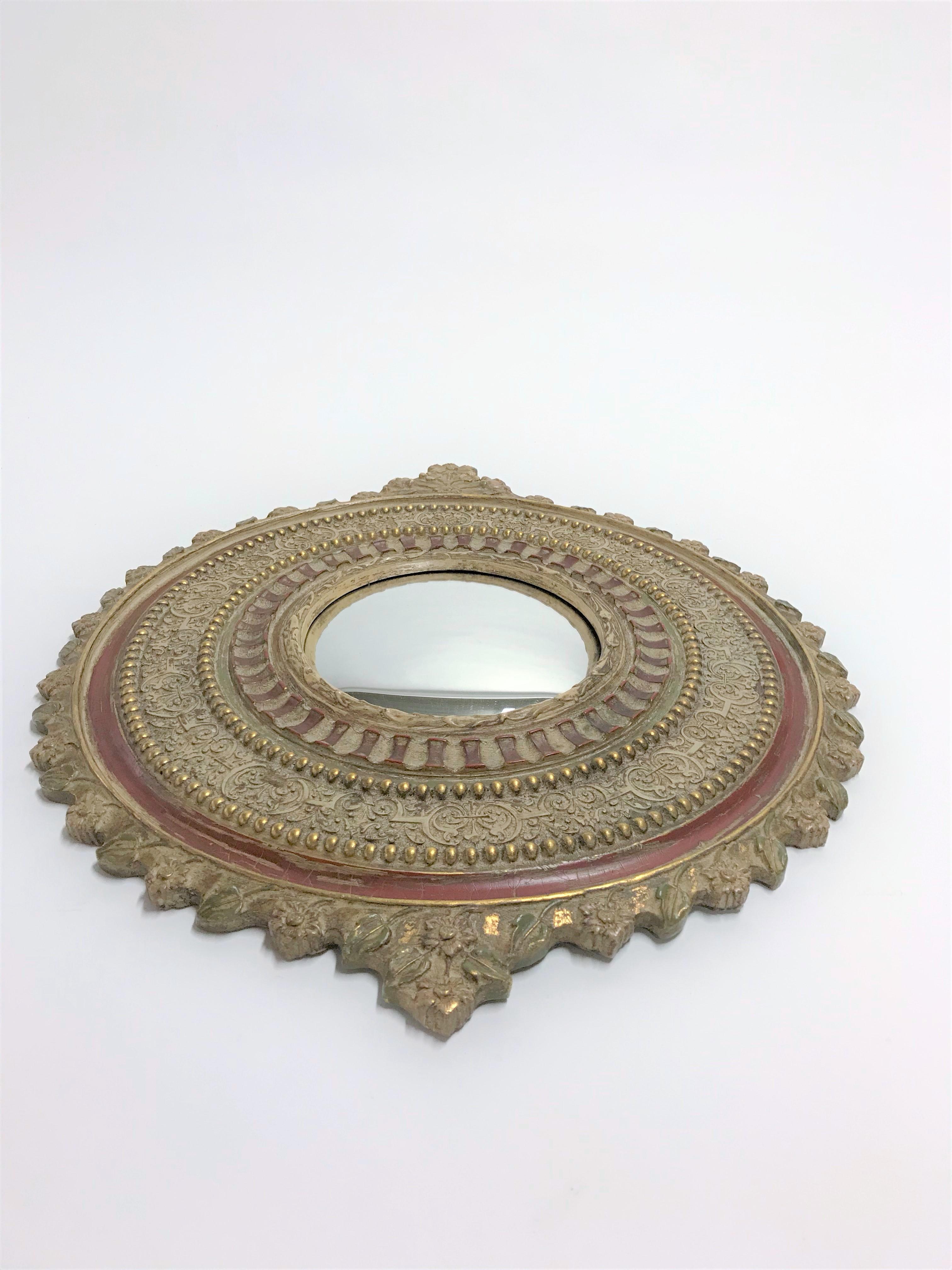Vintage decorated convex mirror or butlers mirror.

The mirror is made from gilded resin and is decorated with flowers.

1950s, France

Measures: Diameter 57 cm/ 22