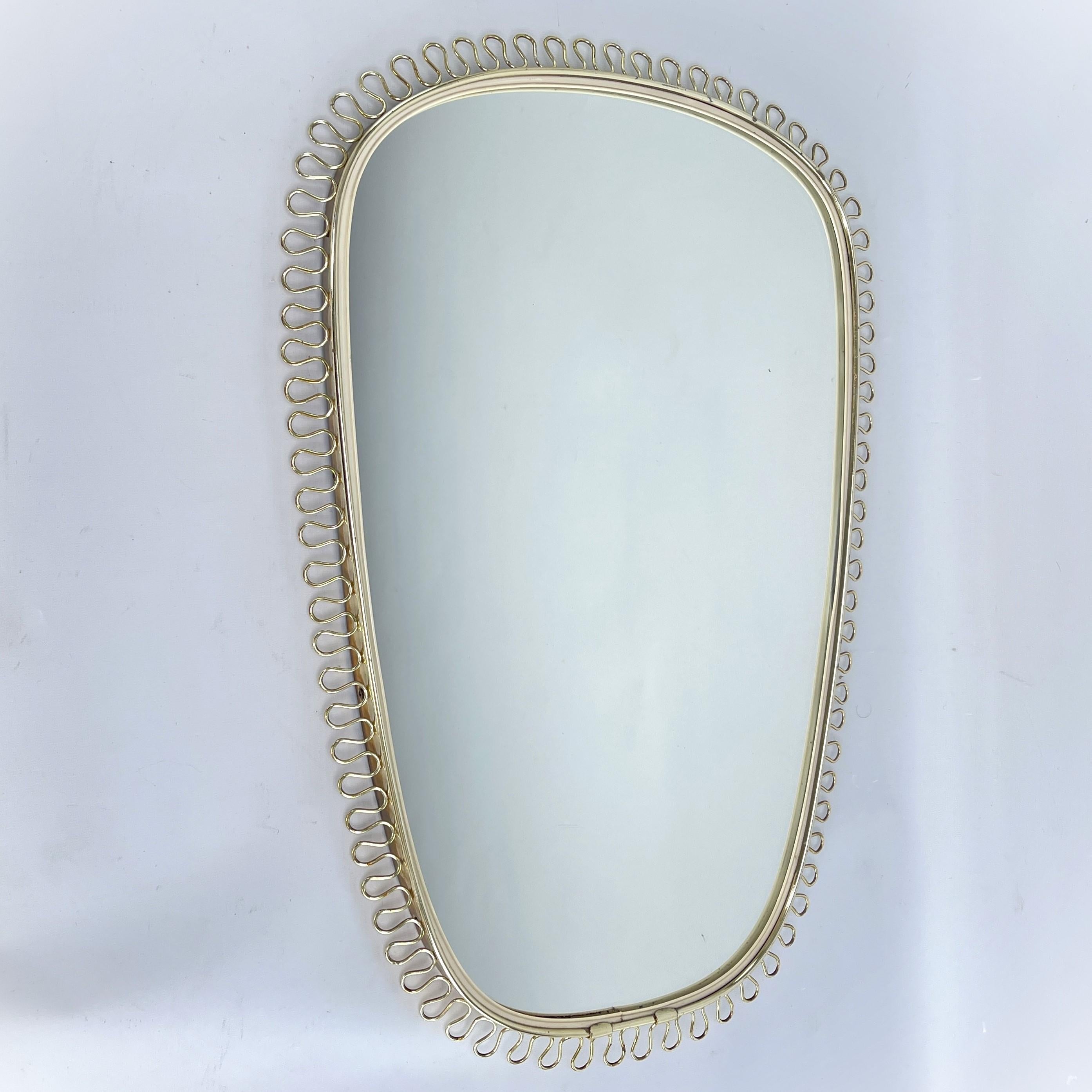 Wall Mirror by Josef Frank - 1950s

The designer of this extraordinary object succeeded in combining functionality, design, style and aesthetics. Even today, this convex mirror is an absolute eye-catcher. The mirror was manufactured from 