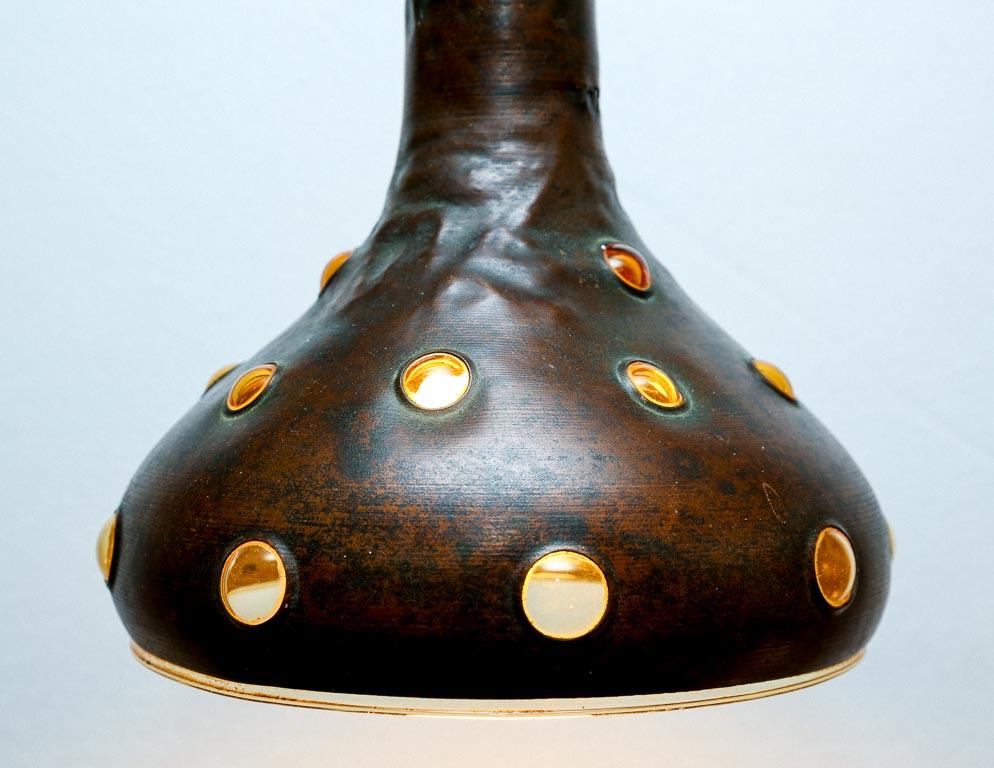 Vintage conical pendant lamp designed by Nanny Still for RAAK, Holland. Unique manufacturing process involves hand blowing a thin layer of glass inside of the copper shade, creating the distinct bubbles that adorn the copper shade.

This lamp is