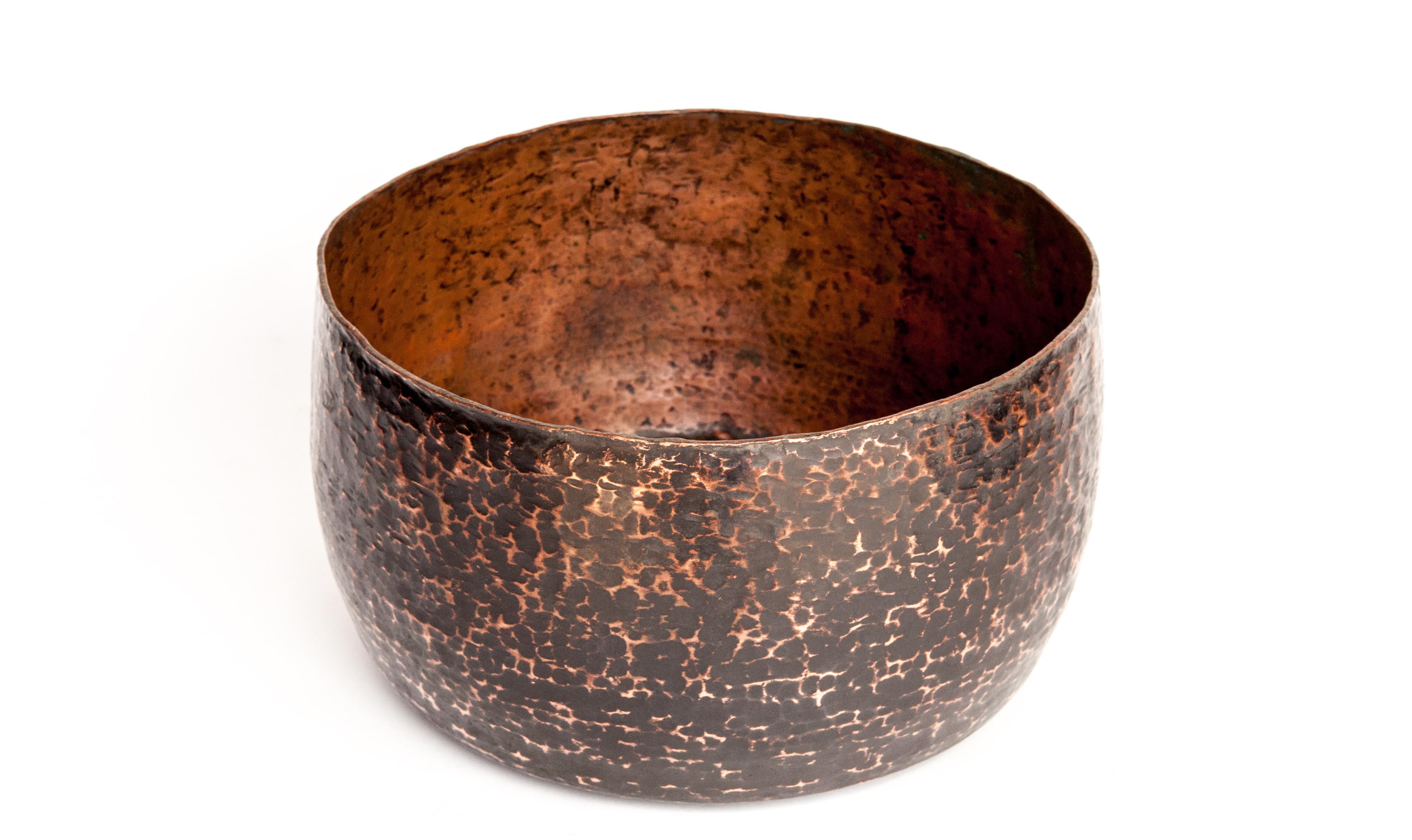 Vintage copper bowl from the Nepal Himal. Mid-20th century. 12.75 inch diameter.
Hand hammered copper bowl from the mountains of rural Nepal.
Dimensions: 12.75