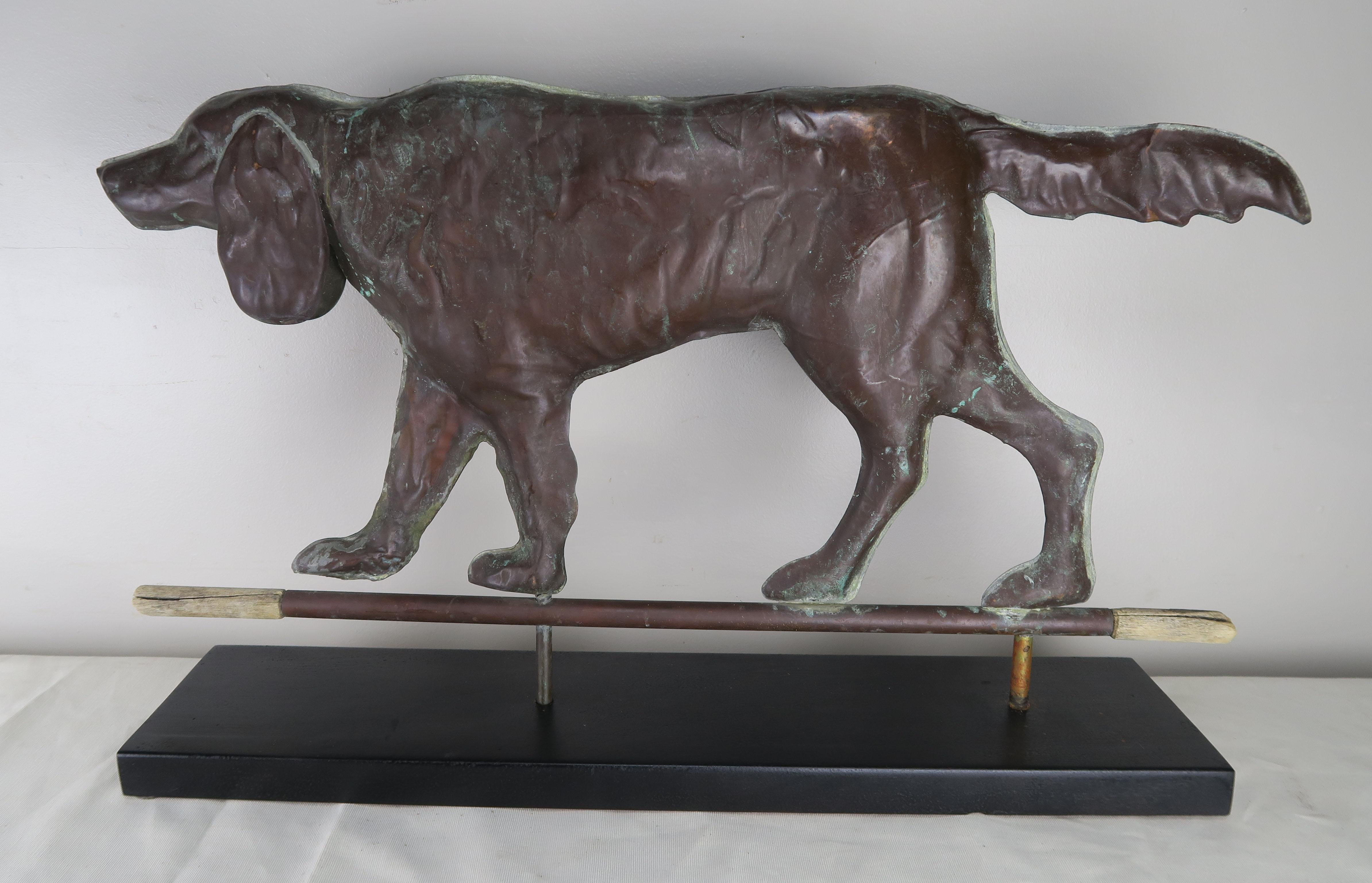 Charming vintage copper dog weathervane that has been newly mounted on a wrought iron and wood base. It is a perfect mantel (fireplace) decor. Wear consistent with age and use.