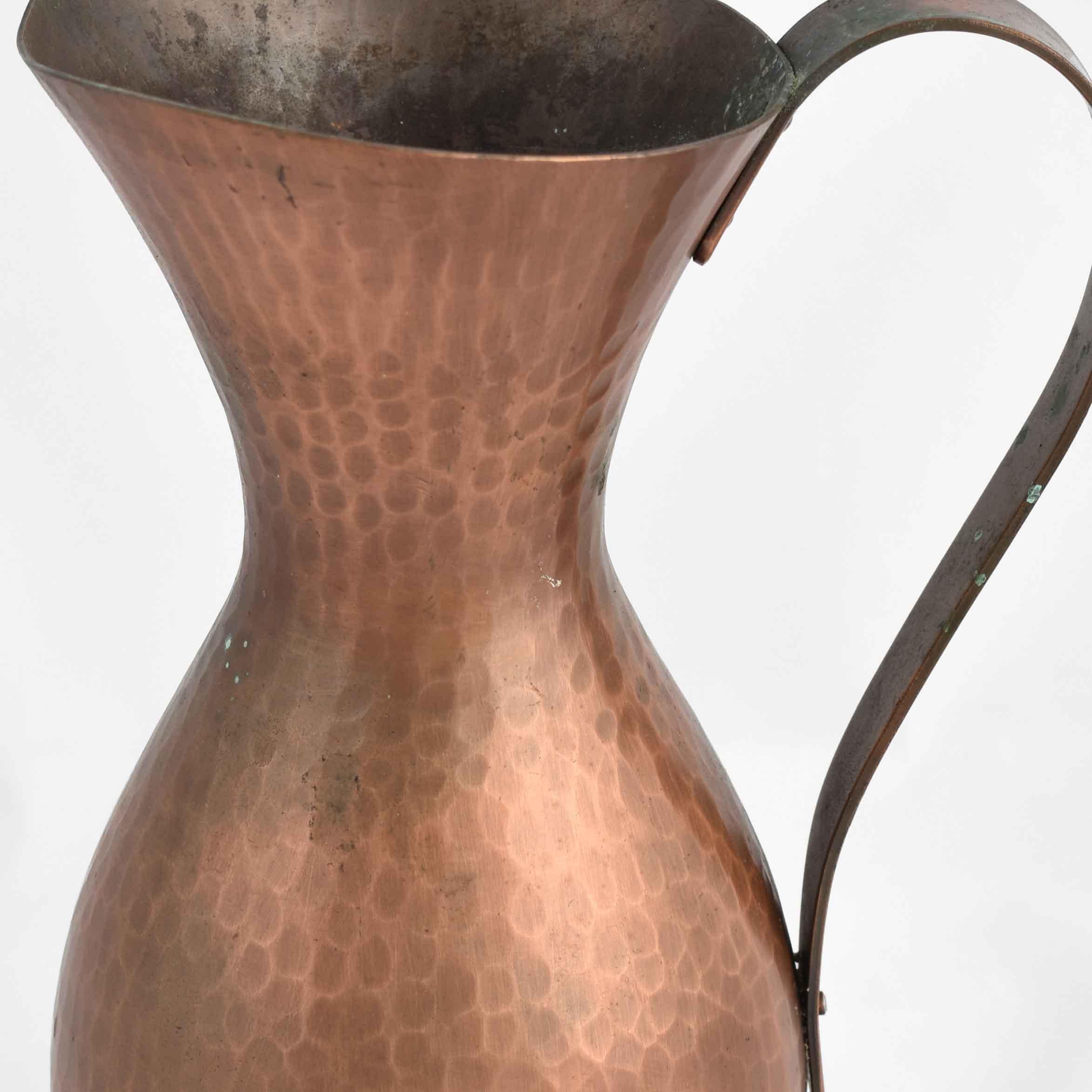 Vintage Copper Pitcher is an original metal set realized in the 1950s.

Original copper.

Made in Germany, created by Eugen Zint.

Goog conditions: each with light signs of aging.

Fine piece of design realized in copper; marked at the base