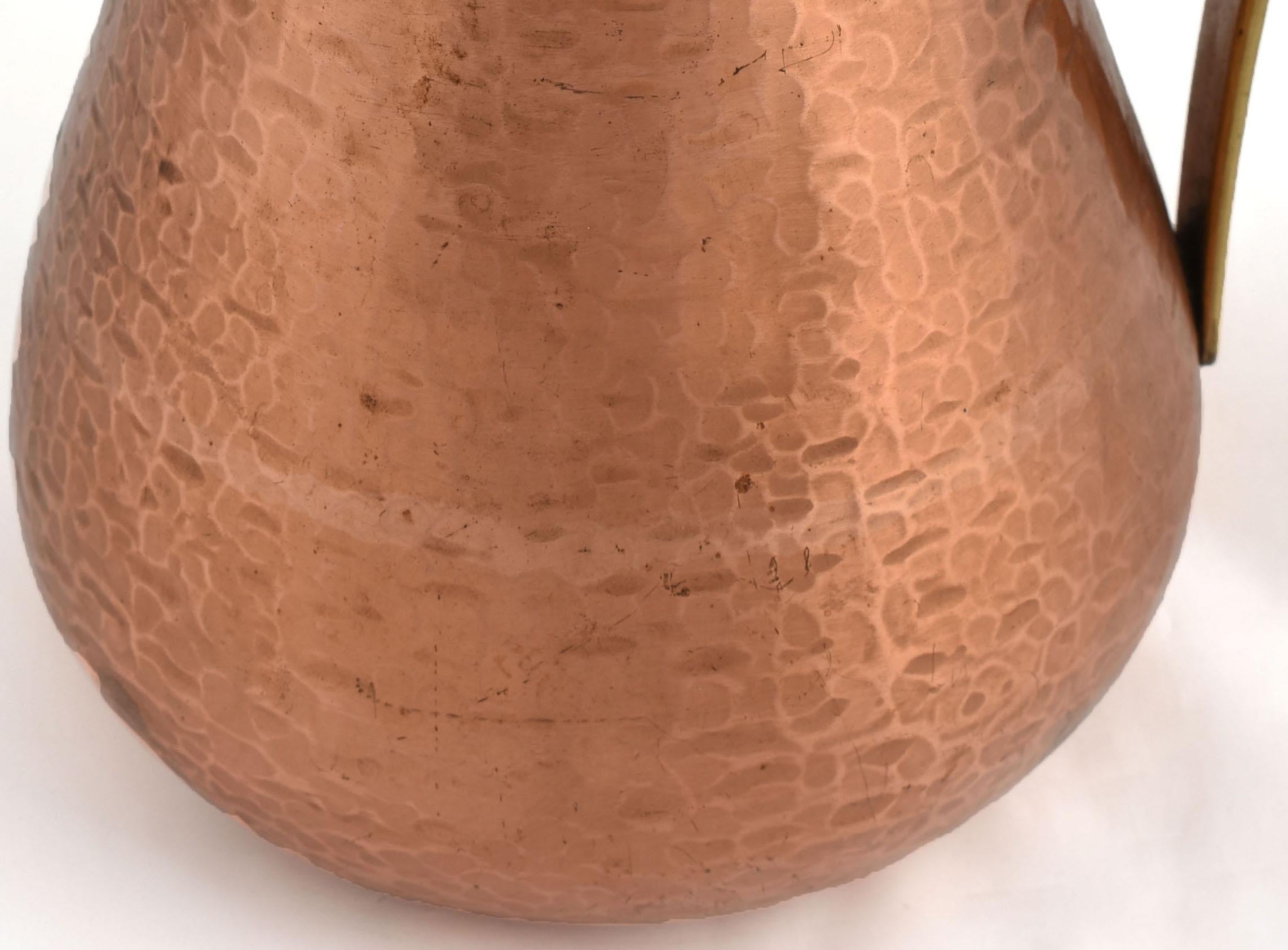 Copper Pitcher is an original object realized in the 1950s.

Original copper.

Made in Germany, created by Harald Buchrucker.

Goog conditions: signs of aging.

Elegant and minimal copper servingpot with conical sides and displayed mouth and