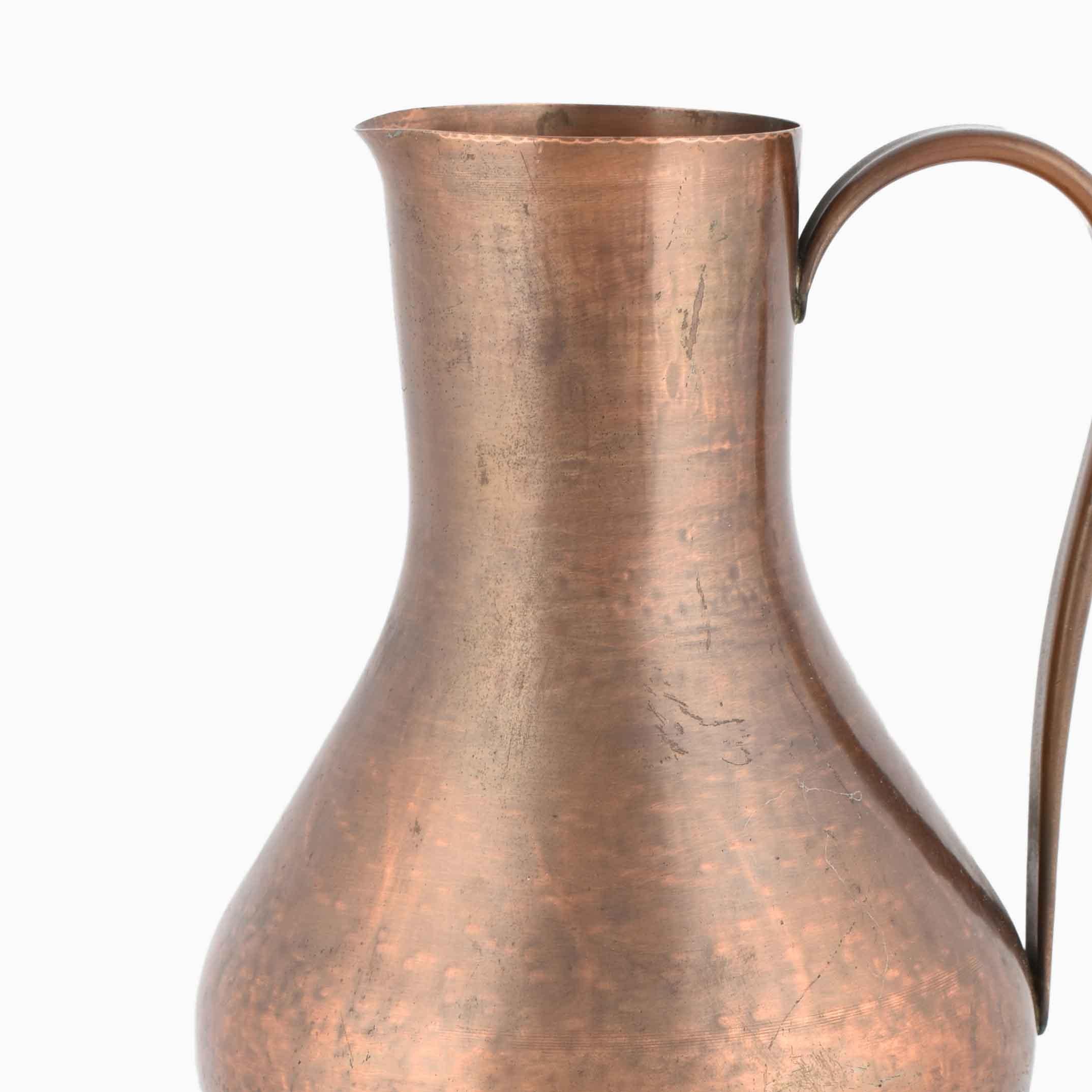 Vintage copper pitcher or vase with handle is an original decorative object realized in the 1950s.

Original copper. Handmade in Germany.

Designed by Harald Buchrucker.

Good conditions.

Original handmade copper manufacture realized in