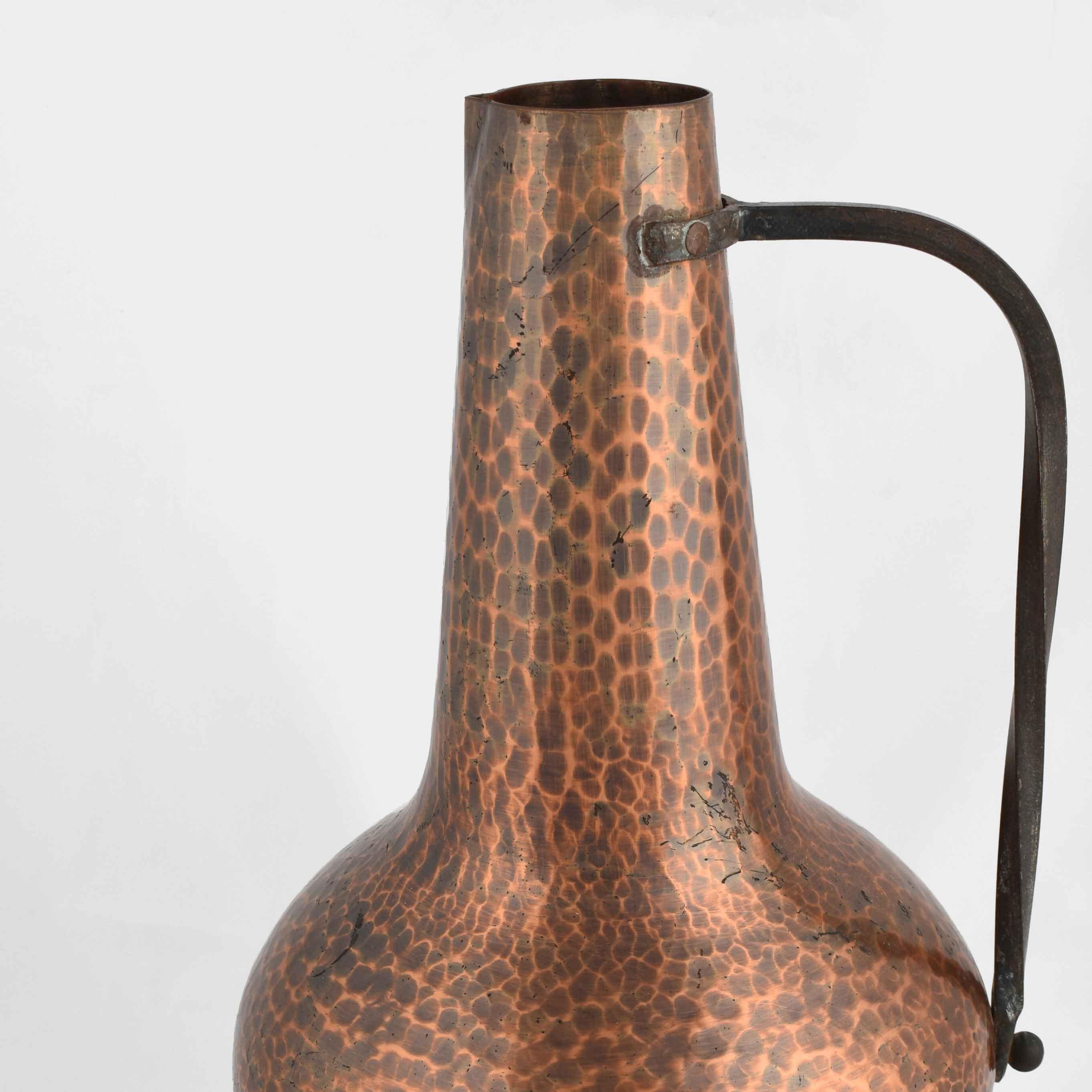 Copper Pitcher with Handle is an original decorative object realized in Germany between the 1950s and the 1960s. 

Original copper object.

Good conditions, normal signs of aging are present.

Fine German vintage Copper by Wall Metalwork with