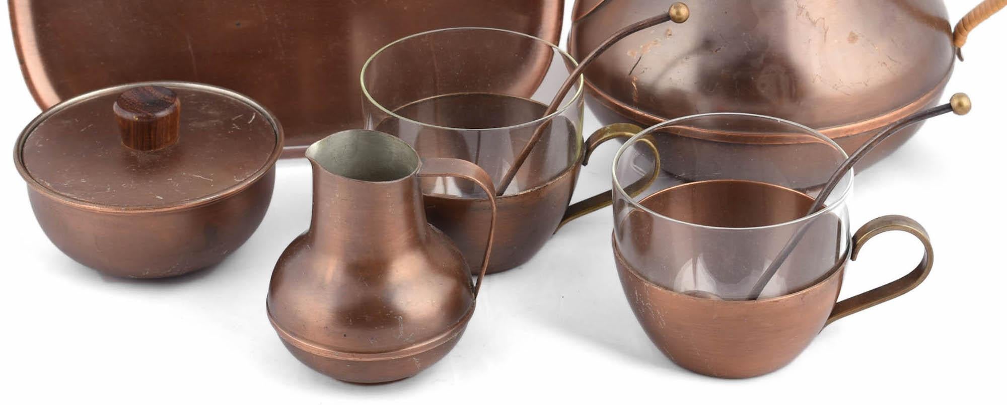 Tea Set is an original artwork realized in the 1950s. 

Original copper and glass. 

Handmade in Germany by Harald Buchrucker. 

The set is complete and includes: 1 jug, 1 tray, a cream server, a sugar bowl, 2 tea cups with glass insert and 2