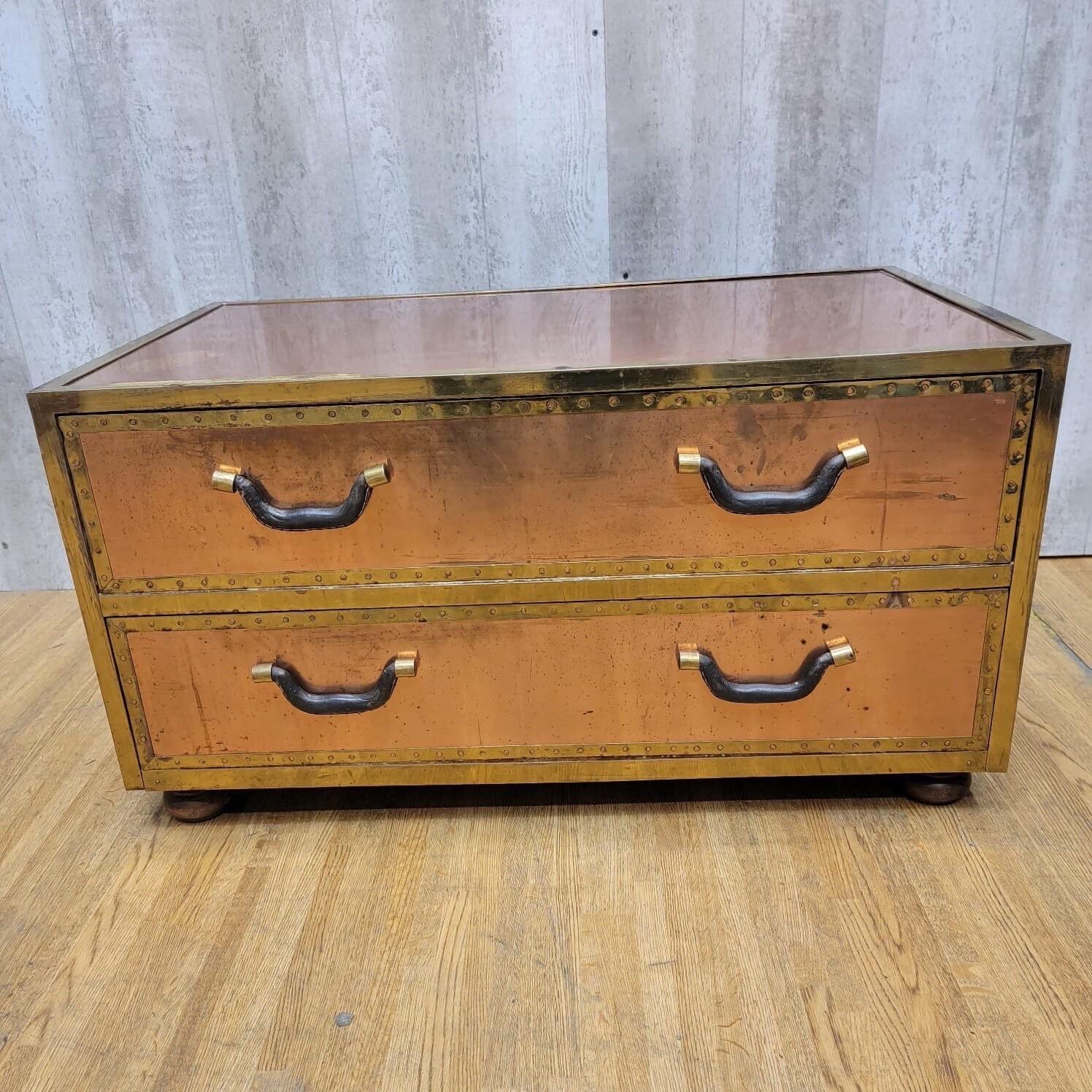 Vintage Copper Trunk Style Coffee Table with Leather Handles

Vintage Copper Trunk Style Coffee Table with Leather Handles & Glass Top with Two Drawers

circa 1940

Dimensions:

H 18