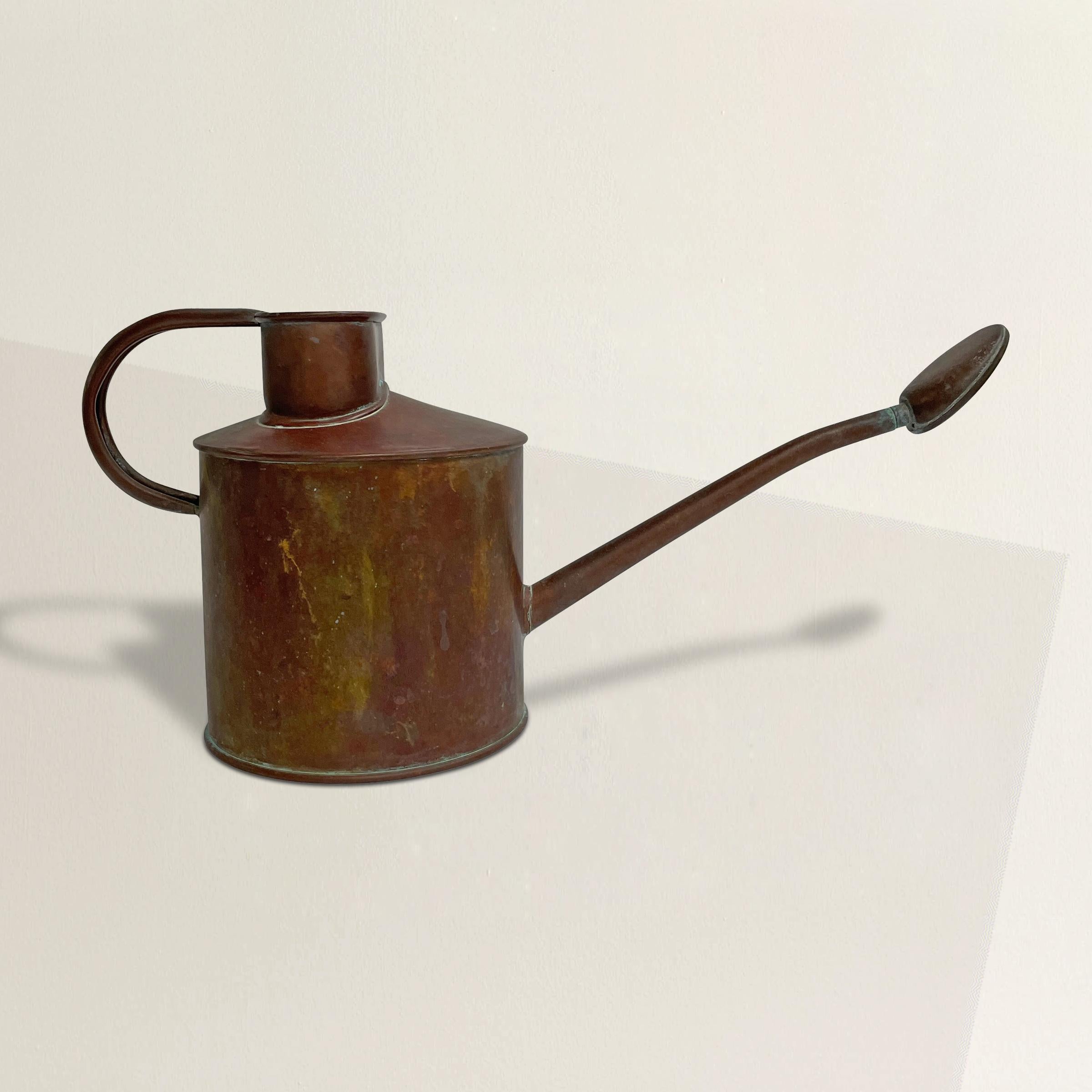A faithful and hardworking vintage American copper watering can with a removable sprinkler head and fantastic patina that only time and use could bestow. Perfect for watering house plants, or smaller planters on your patio.