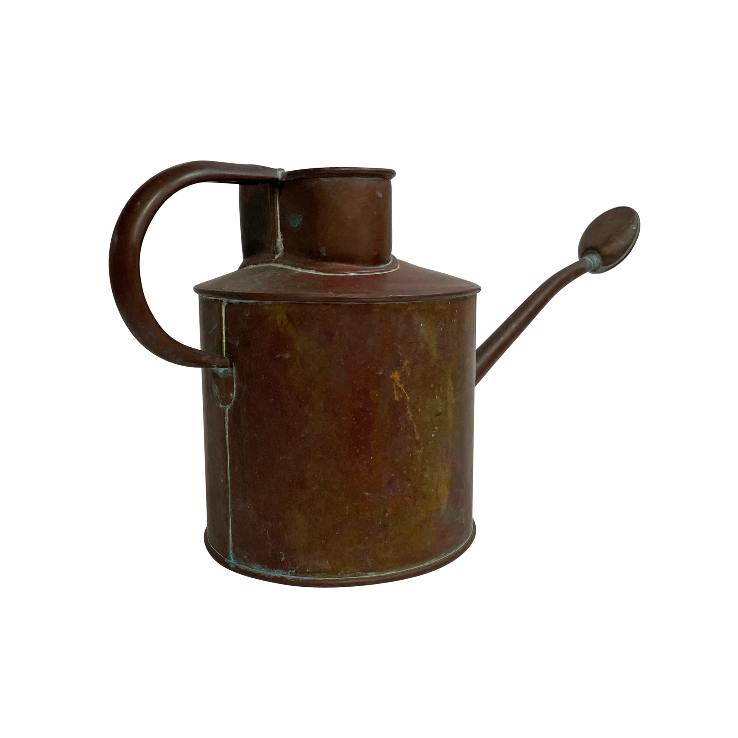 antique copper watering can