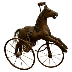 Exemplaire vintage d'un cheval de pédale victorien à cheval de tricyclette