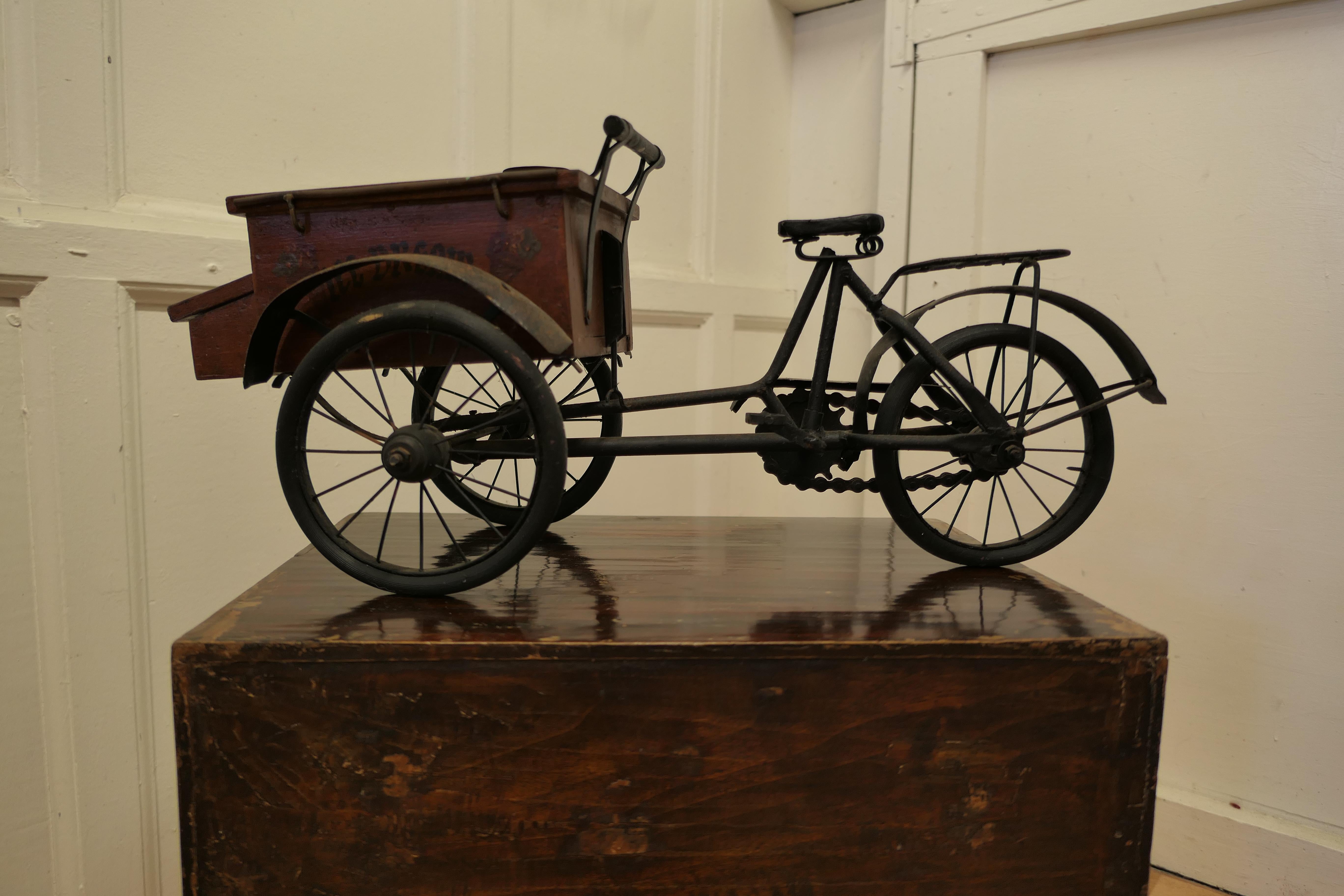 Vintage copy of an American ice cream pedal tricycle

A delightful wagon, this is a hand made copy, made some 60 years ago of a well known 19th century design, surely an antique of the future
The frame and wheels etc. are made in iron, and the