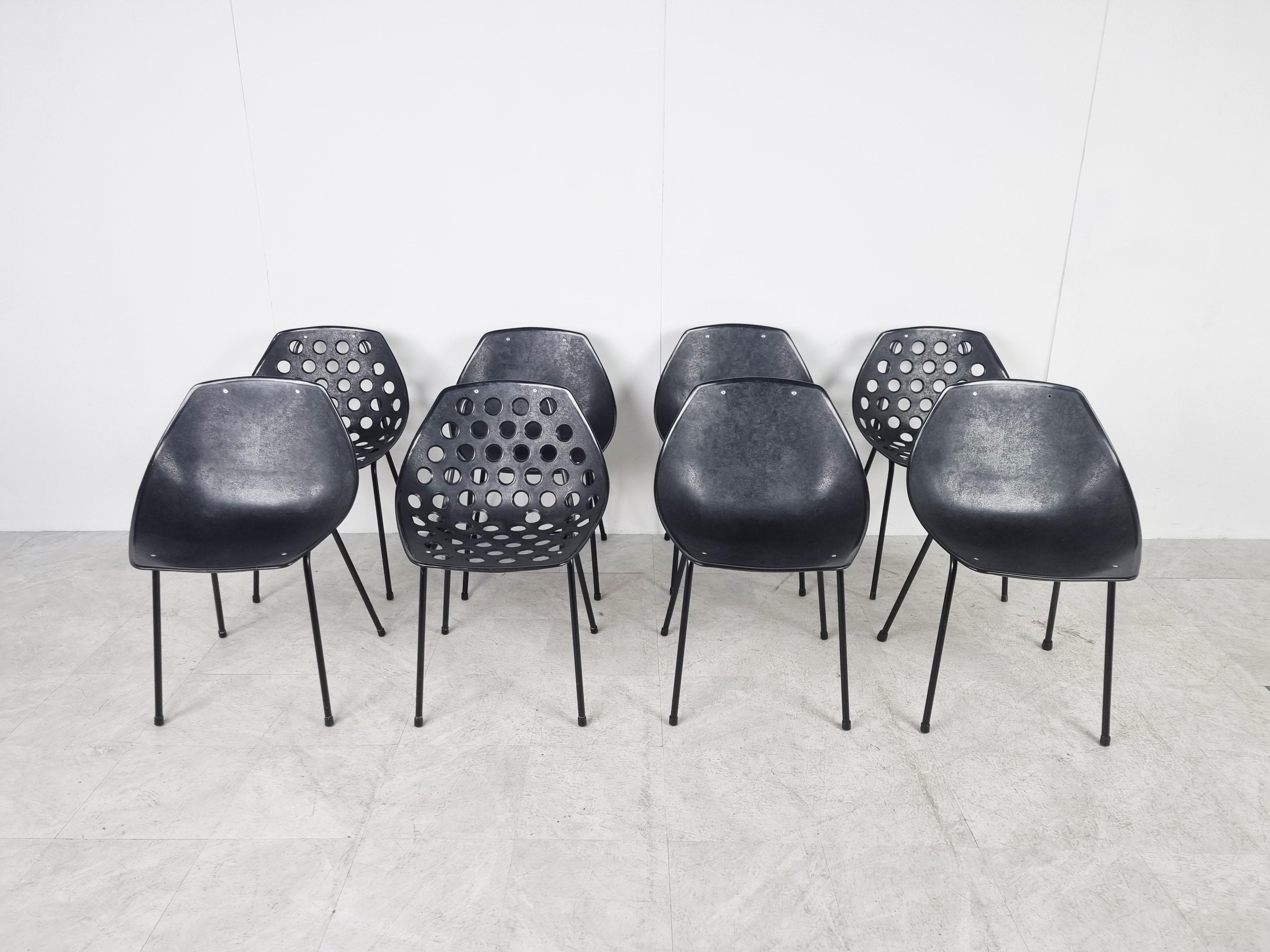 Set of 8 vintage coquillage chairs by French designer Pierre Guariche for Meurop.

This set of chairs is made from a plastic shell mounted on an elegant black metal base

Both in and outdoor use is possible.

set of 8 (3 with holes and 5