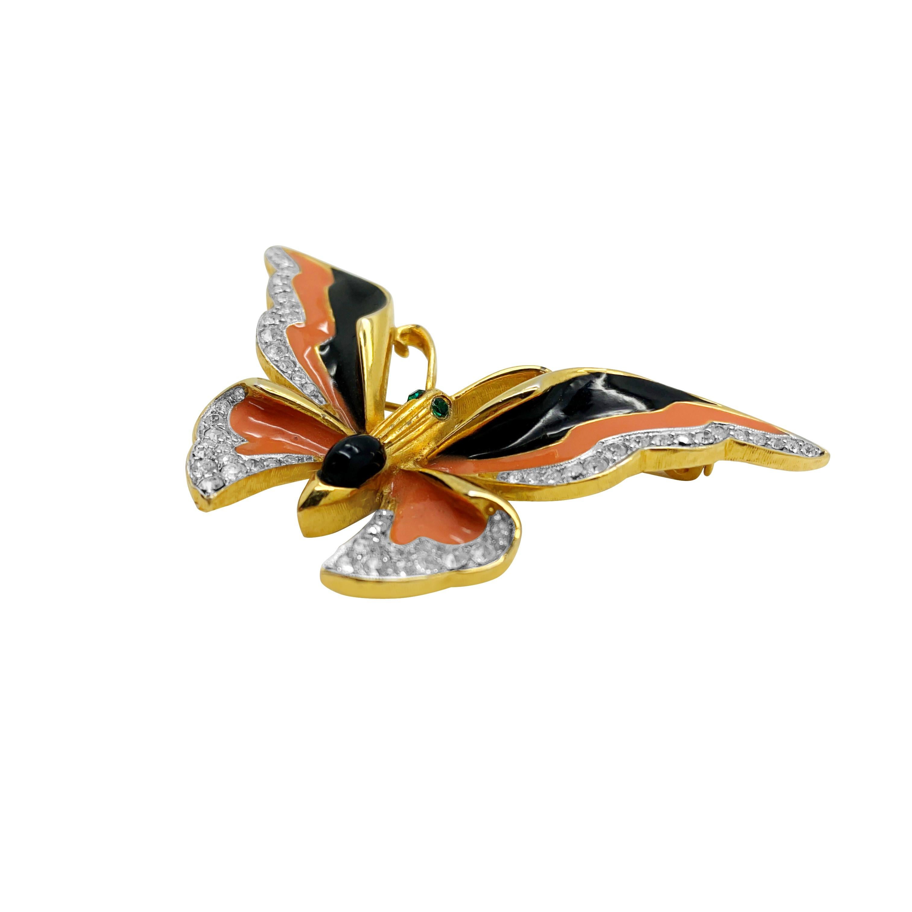 A Vintage Enamel Butterfly brooch. Featuring an adorable colour way of coral and black upon gold. 
Vintage Condition: Very good without damage or noteworthy wear. 
Materials: gold plated metal, crystal, enamel
Signed: unsigned
Fastening: rollover