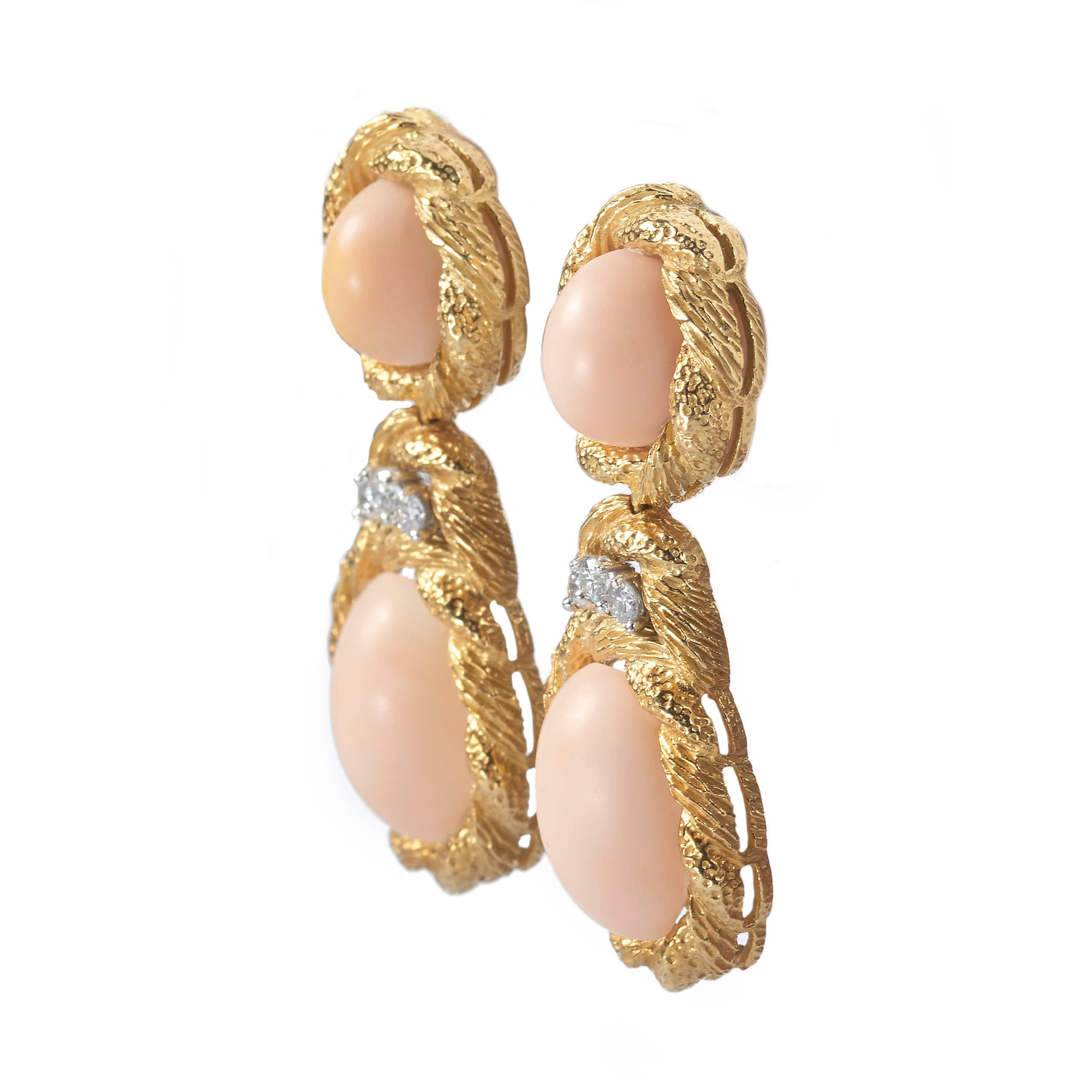 A pair of vintage coral and diamond drop earrings, each formed of two oval gold clusters, set with cabochon-cut corals within a gold twisted bark effect mount, with round brilliant-cut diamond detail between, with post and lever back fittings,