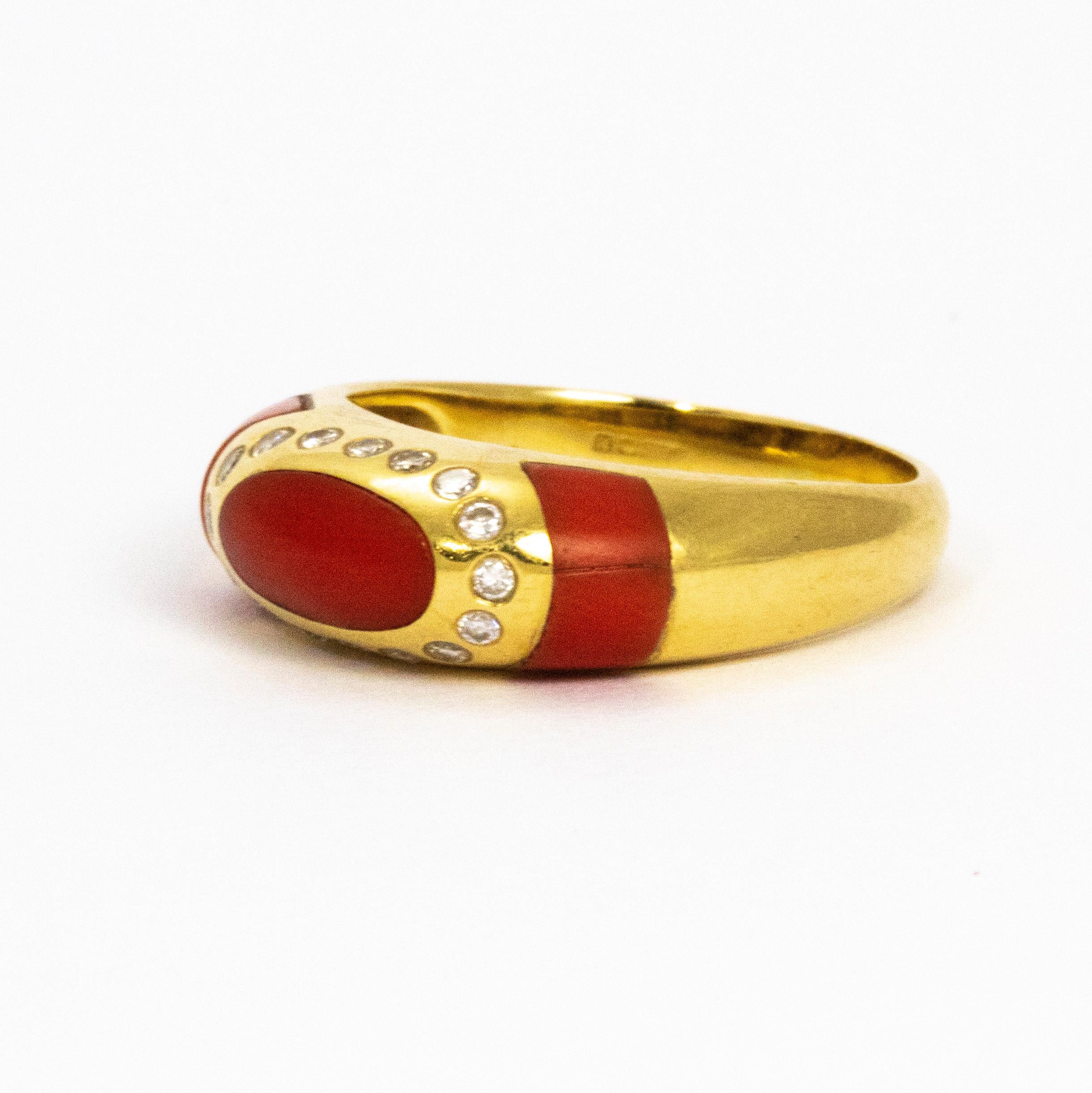 Bright and sparkling coral and diamond details all set in a smooth design 18ct gold band.

Ring Size: N 1/2 or 7