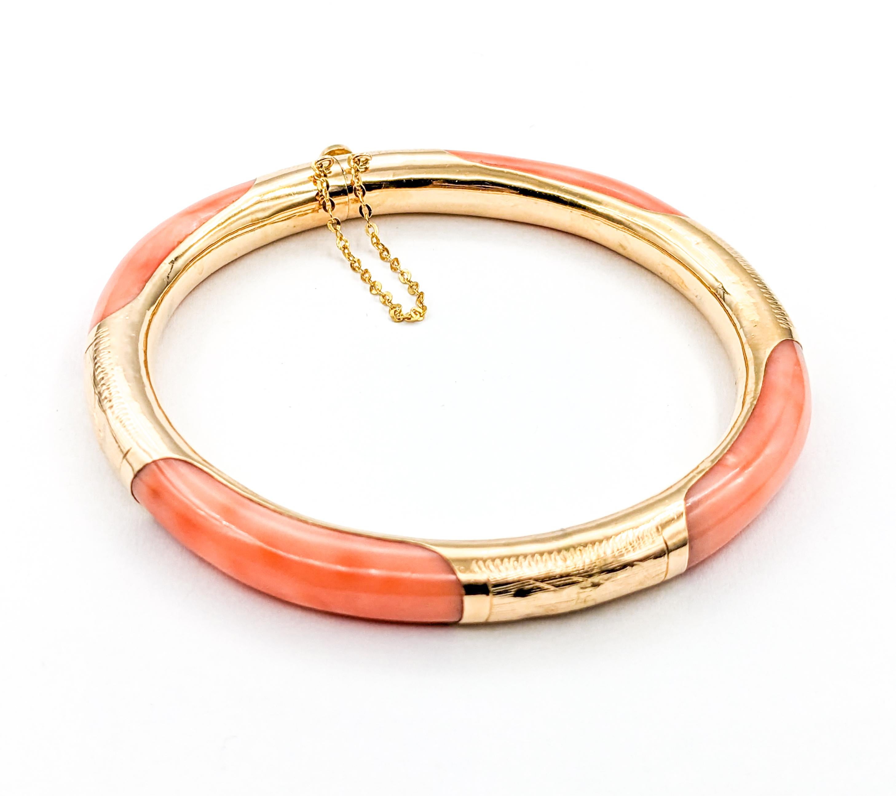 Vintage Coral Bracelet In Yellow Gold

Discover the charm of a bygone elegance with this beautiful vintage bangle bracelet, masterfully created from 14kt yellow gold. This classic piece is adorned with a striking coral organic gemstone, known for