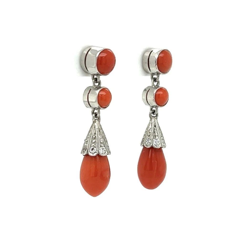 Simply Beautiful! Stylish and finely detailed Vintage Deep Red Coral Briolette Drop and Diamond Platinum Earrings. Hand set with 6 Red Coral gemstones, weighing approx. 0.39tcw and 16 Old European Cut Diamonds, weighing approx. 0.39tcw. Measuring
