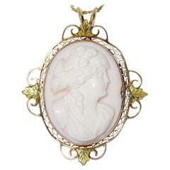 Antique Coral Cameo Brooch Ornate Filigree Bezel 10 Karat Yellow and Green Gold