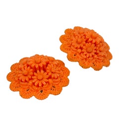 Vintage coral celluloid flower clip on earrings