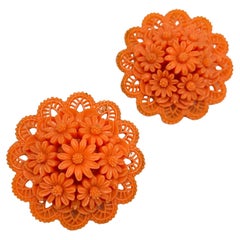 Vintage coral celluloid flower clip on earrings