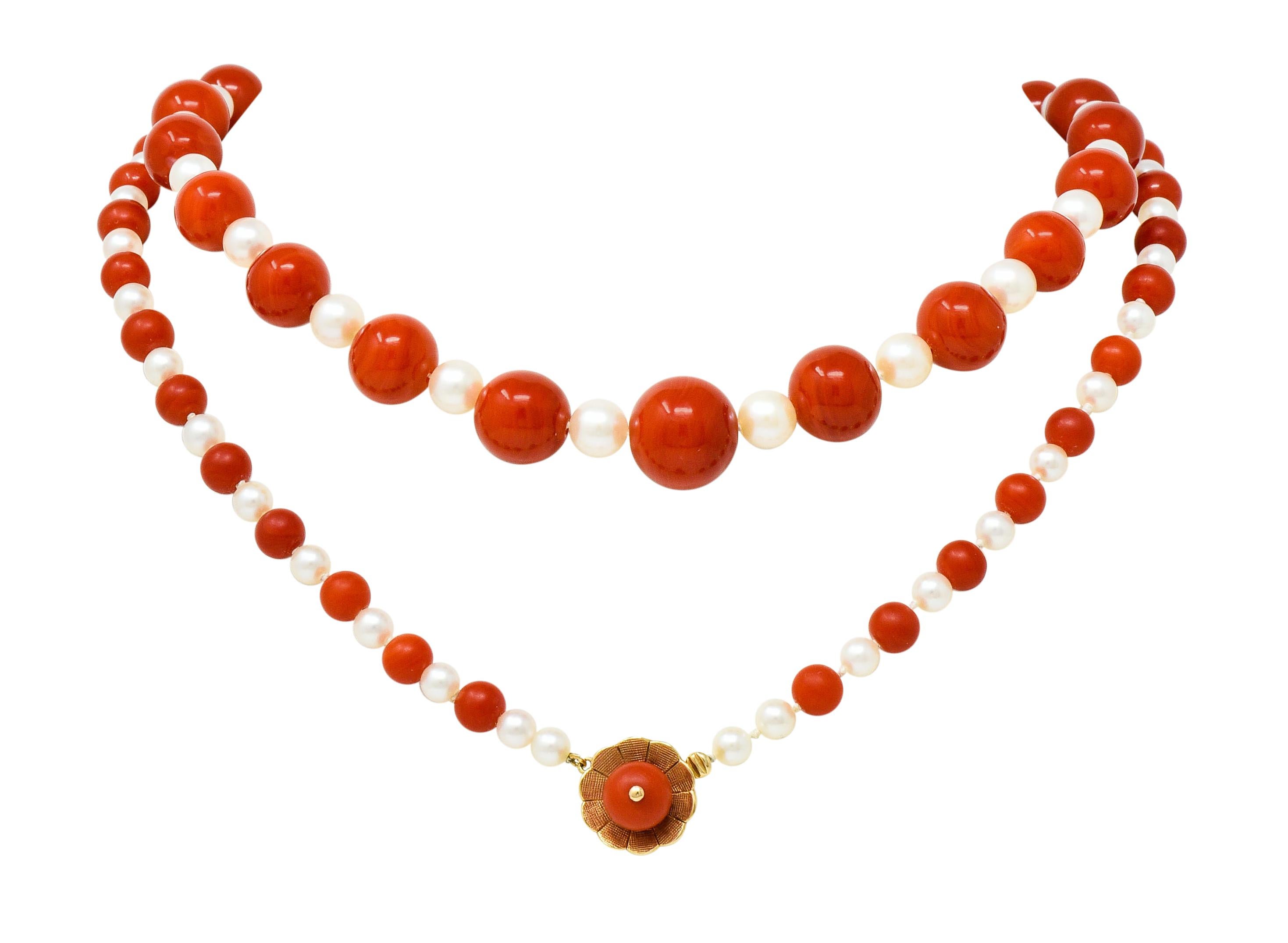 Strand necklace is hand-knotted with coral beads alternating with cultured pearls; graduating in size

Coral measures 13.4 to 6.1 mm and are very well-matched with evenly distributed orangey-red color

Cultured pearls measure 6.8 to 4.6 mm and are