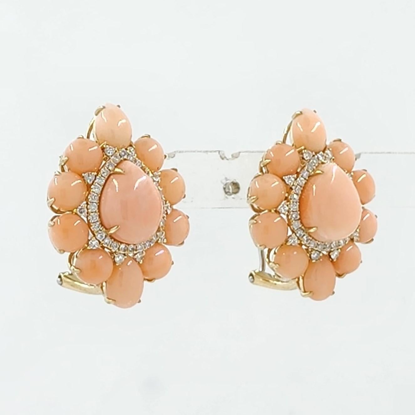 Step into the realm of classic elegance with these exquisite vintage angel skin coral earrings, lovingly crafted in radiant 18 karat rose gold.

At the centerpiece of each earring, a delicate pear-cut angel skin coral beckons with its soft, ethereal