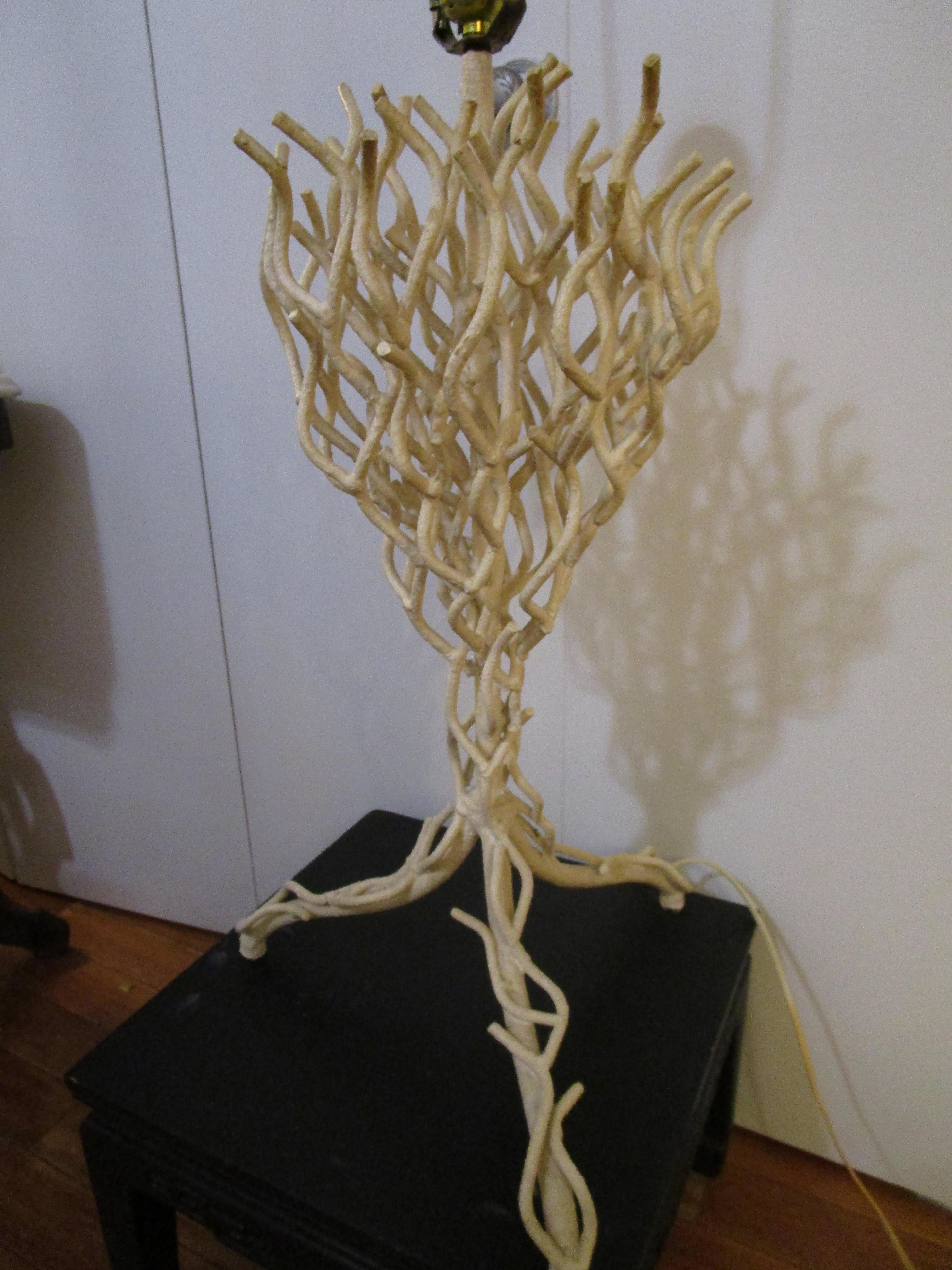This is a rare vintage white painted twig form lamp that is made of wrought iron rendered in the most incredible coral effect. The lamps is full of possibilities. This is a designer's medium to update and change the color to silver, white or gold,
