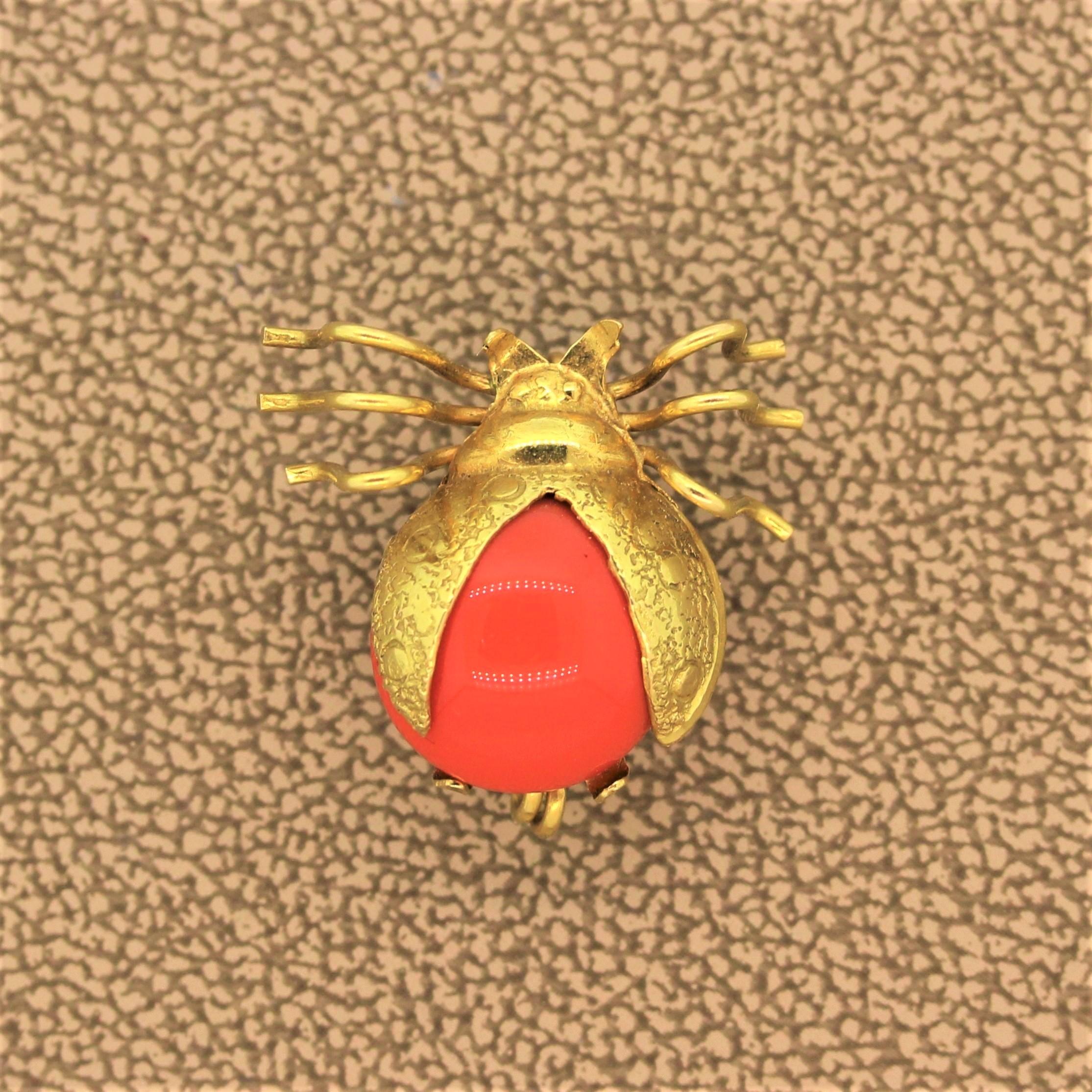 Ladybug! A sweet crawling ladybug with her wings sprawled out ready to take flight. This piece doubles as a pendant to wear on the chest. The body is a cabochon coral with 18K yellow gold used for the filigreed wings and her long legs.  

Brooch