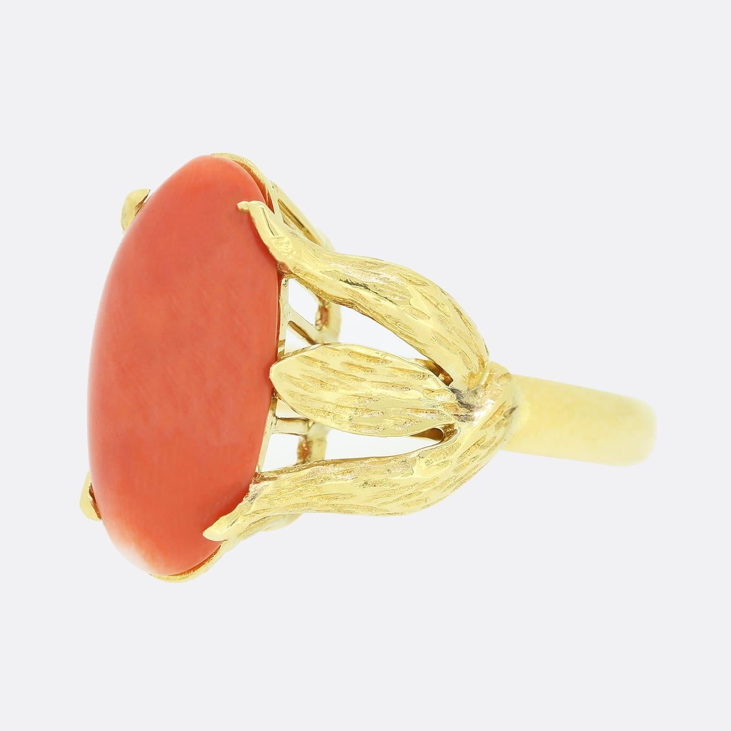 This is an 18ct yellow gold coral ring. The central coral stone is held with 6 prongs that take the form of leaves. the coral stone is a beautiful orange colour and has a small white patch at one end.

Condition: Used (Very Good)
Weight: 5.8