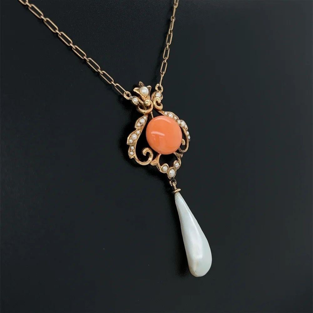 Simply Beautiful! Vintage Coral Seed Pearl and Pearl Drop Victorian Pendant Necklace. Hand set with a Coral Button surrounded by Seed Pearls and a Pearl Drop. Suspended from a 16” Gold chain. Hand crafted in 14K Yellow Gold. More Beautiful in Real