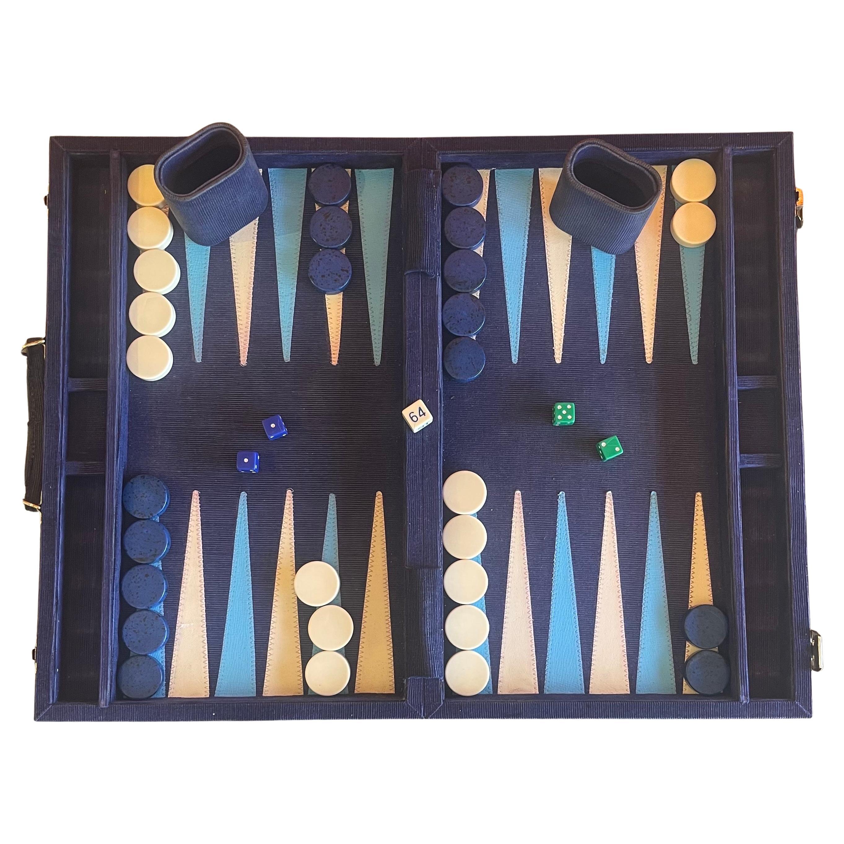 Vintage corduroy and bakelite backgammon set, circa 1970s. Set is complete with a foldable case / board with blue corduroy fabric, 30 bakelite checkers (white and deep blue in color, 1.5