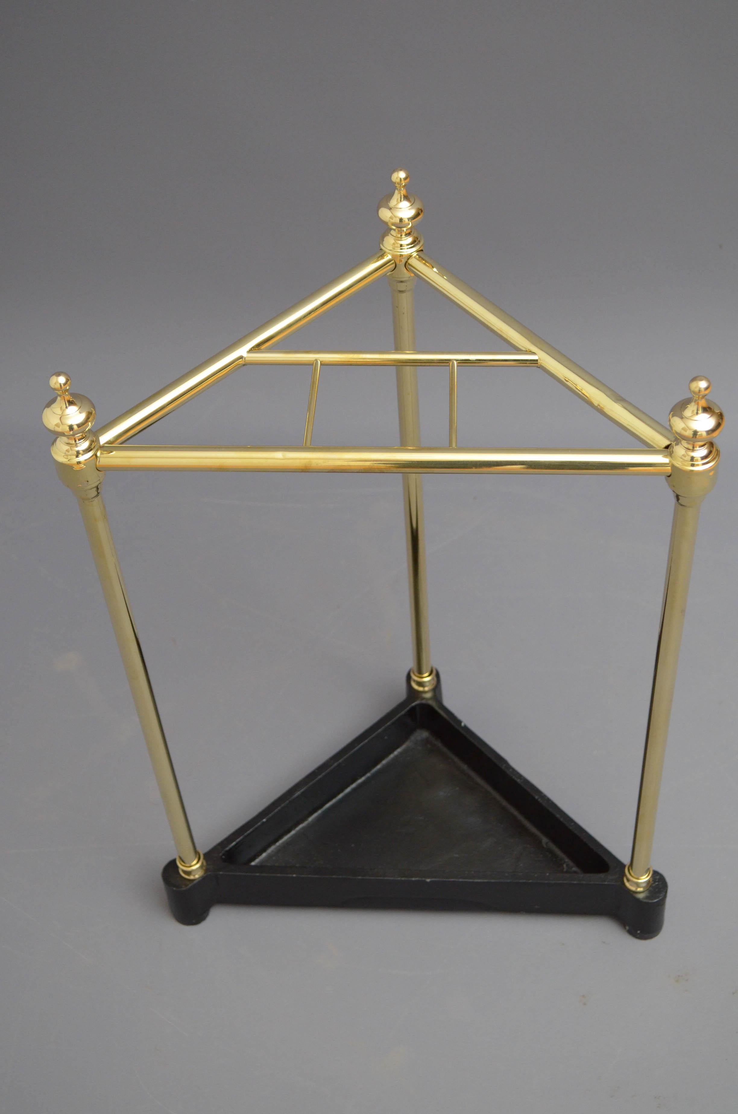 Unusual corner umbrella stand in brass with decorative finials, four umbrella or walking sticks compartments and black drip tray. This stand has been cleaned and polished and is in home ready condition. c1970
Measures: H23.5