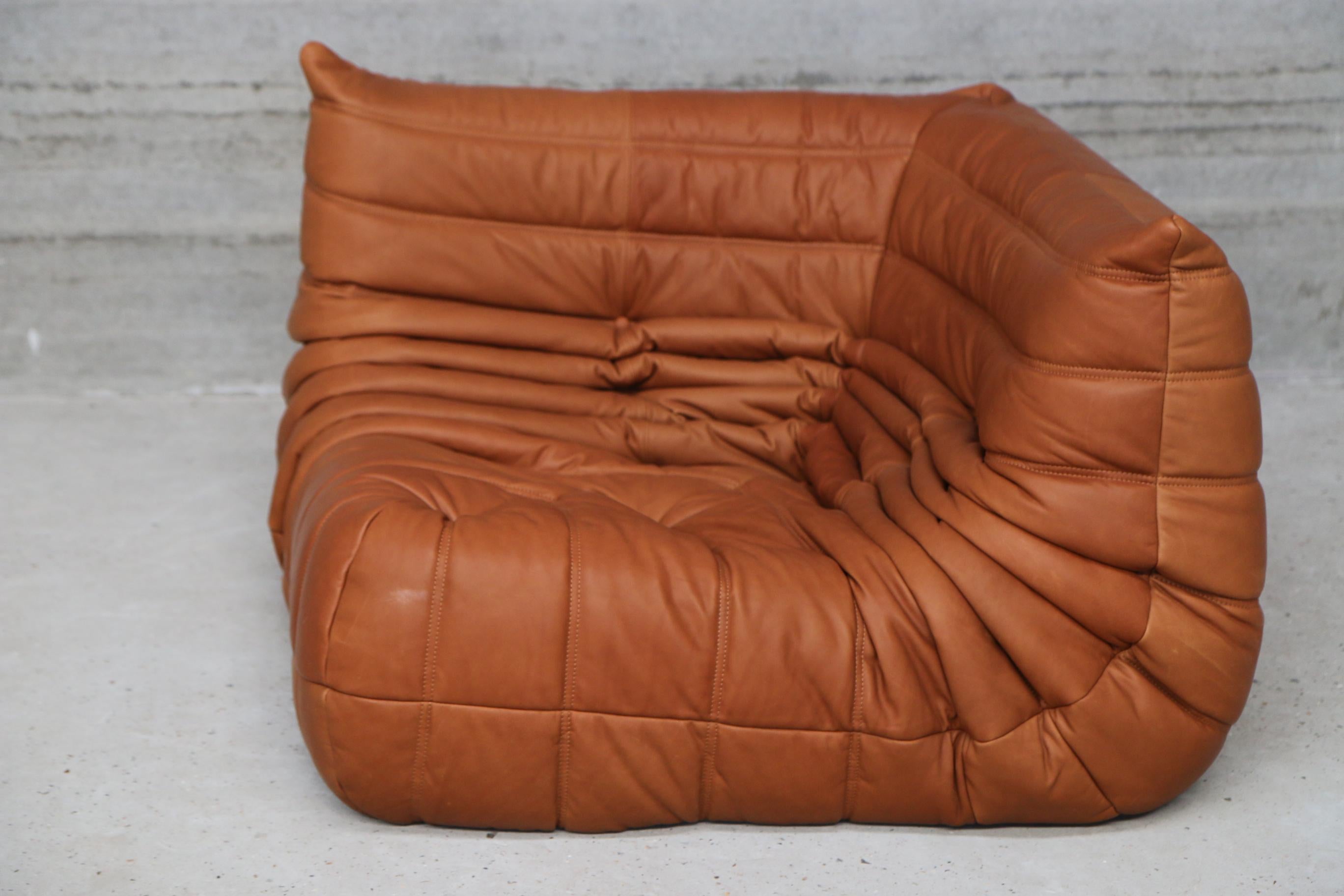 Iconic French vintage Corner Seat, beautifully reupholstered with our signature cognac leather.
Original genuine vintage 