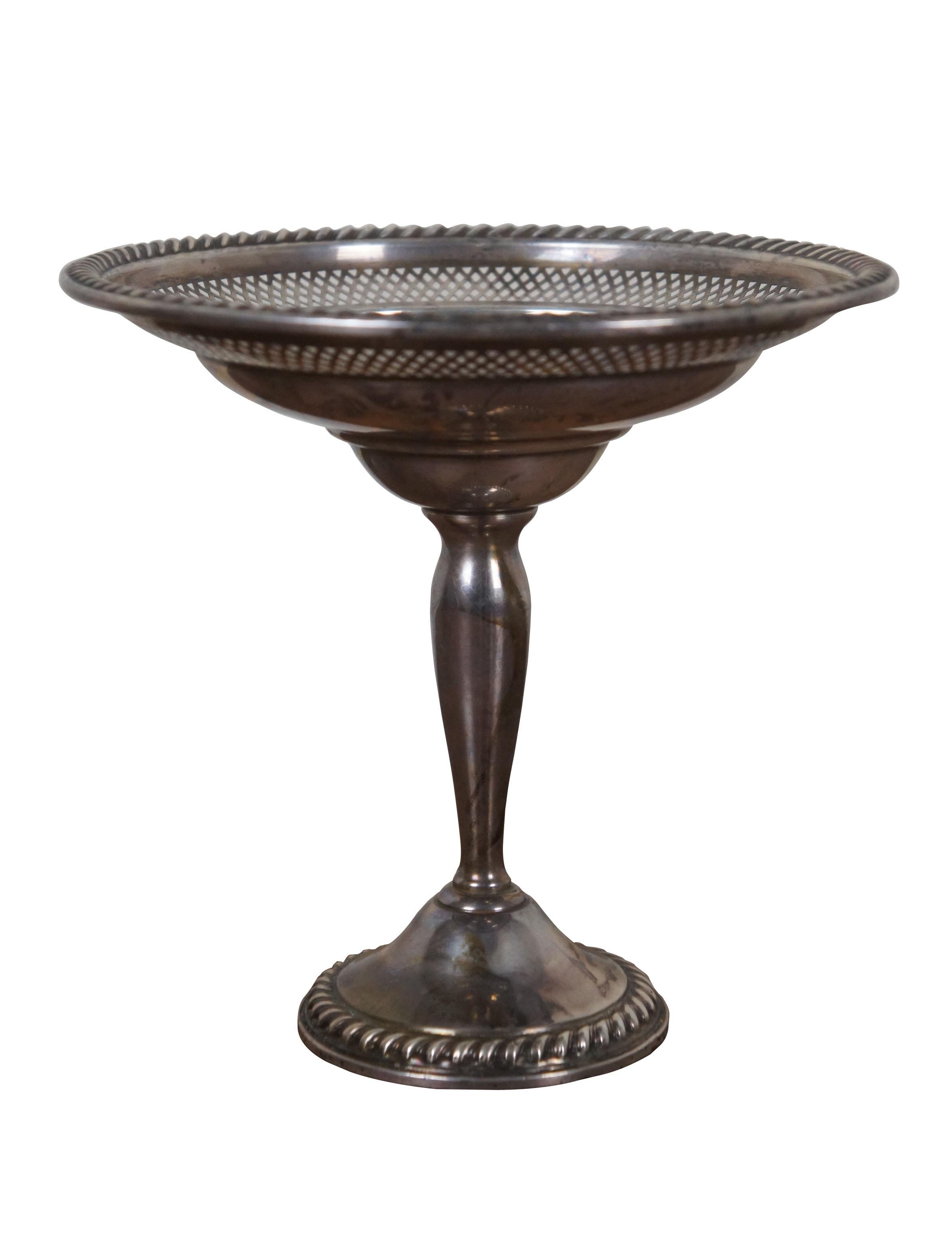 20th century weighted, reinforced, sterling silver number 32 Cornwell compote by Watrous Mfg Co. Pedestal style nut / candy dish with rope twist border and pierced reticulated lattice detail.

WATROUS MFG. CO, The business known as the Watrous Mfg.